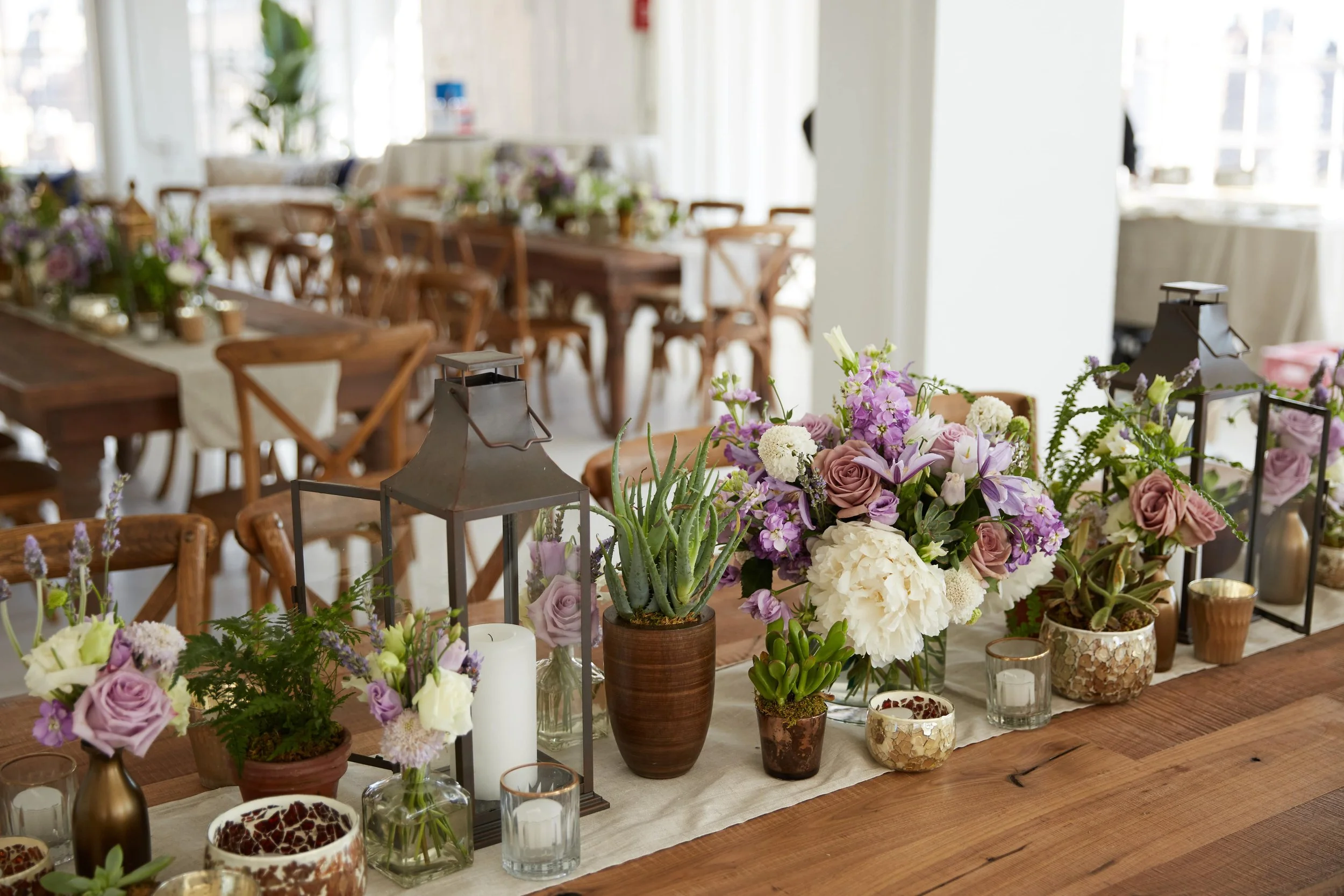 rectangle table collection centerpiece white lavender roses lisianthus succulents campanula scabiosa moroccan pewter copper lanterns studio 450 4-min.jpg