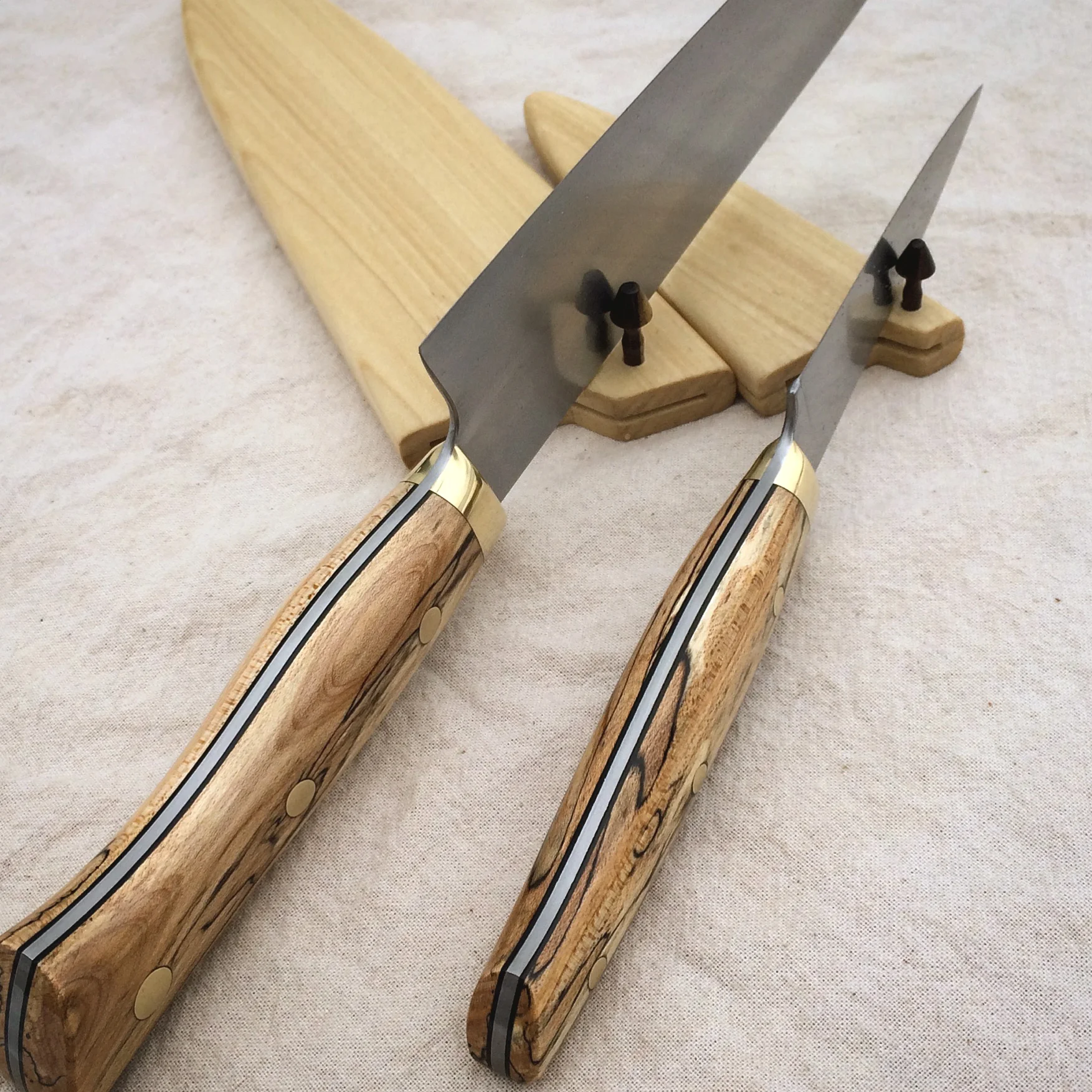 Detail of black phenolic liners, Poplar sayas with African Blackwood pegs. The wood was taken from a Maple tree that once grew in the back yard of the owner's childhood home.