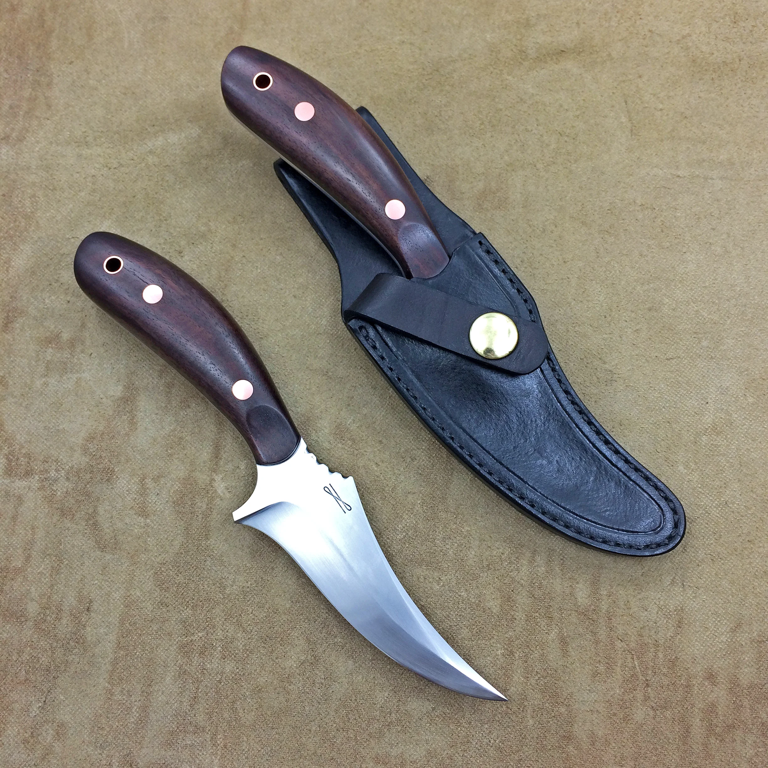 Pair of Hunting/Outdoor knives, inspired by the classic Shrade Sharpfinger. The blades are 1095 steel, handles are from a piece of Walnut from the father of the owners' wood shop, hardware is copper.