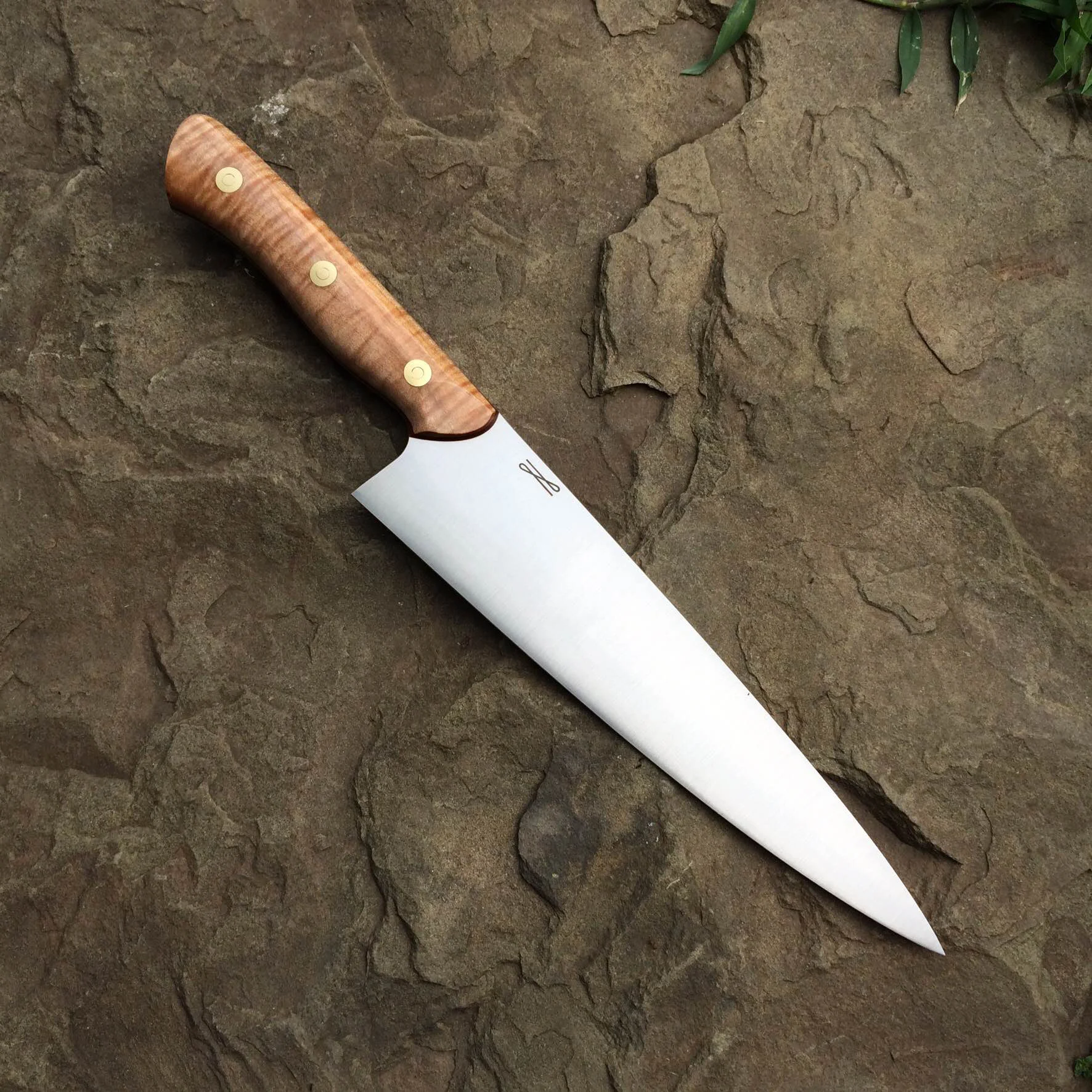 8" Chef Knife, 52100, Stabilized Curly Maple, Red G10, Brass Loveless Bolts.
