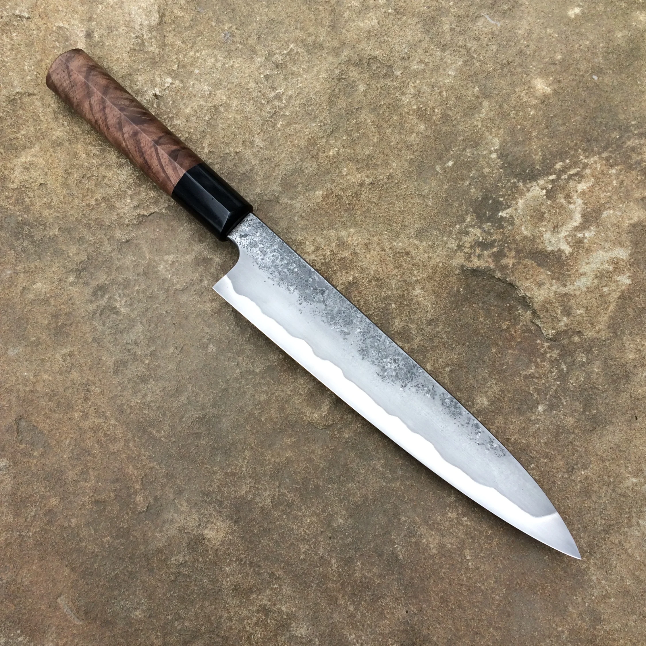 9" Gyuto. W2 steel, differentially heat-treated. Stabilized walnut and horn D-shape handle. 