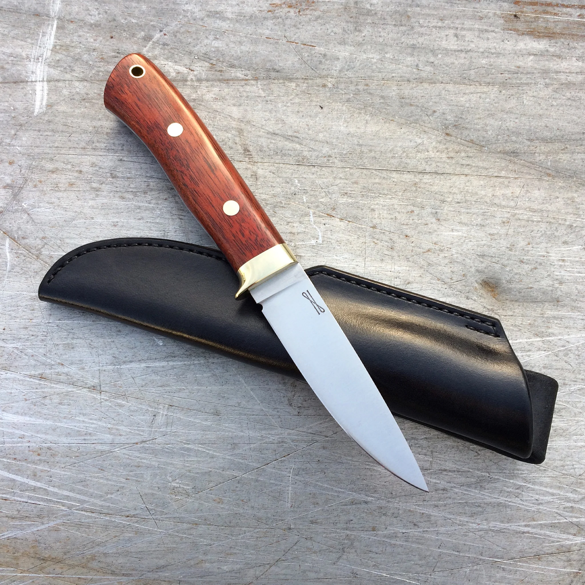 3.5" Drop Point Hunter. 52100 steel, Waterfall Bubinga and Nickel-Silver handle. Custom-fitted 9oz. leather sheath. 