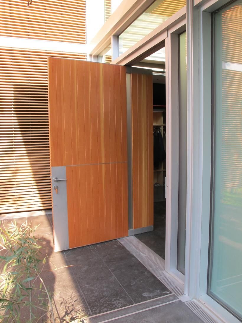 Wood pivot door, aluminum details