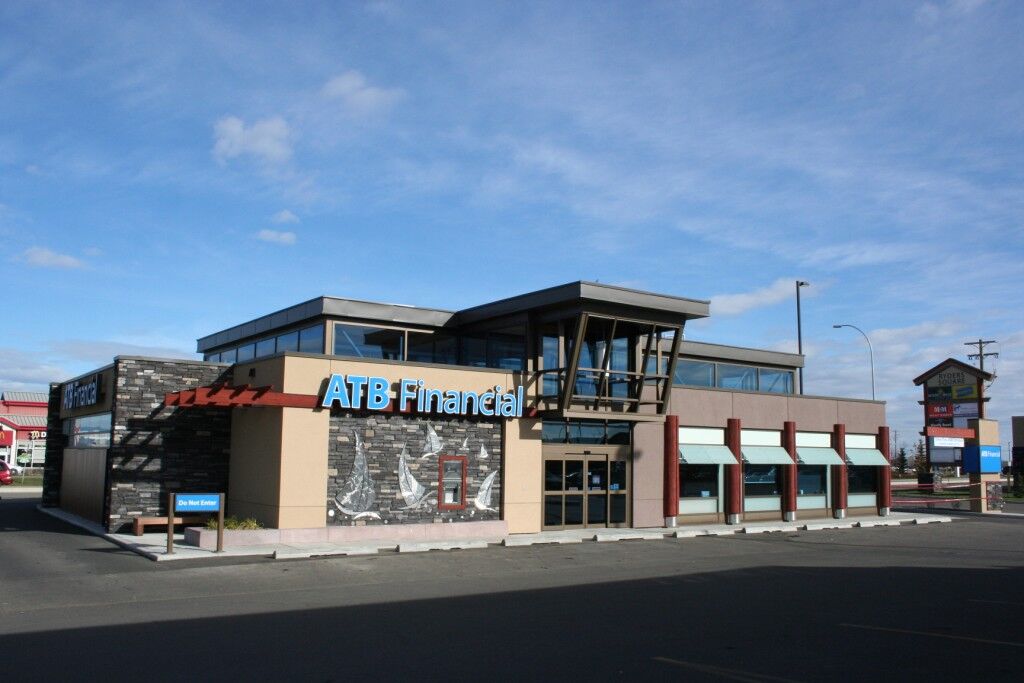 Alumicor 2500 series, automatic sliding doors, custom entrance canopy, glass sunshades and stainless steel brackets