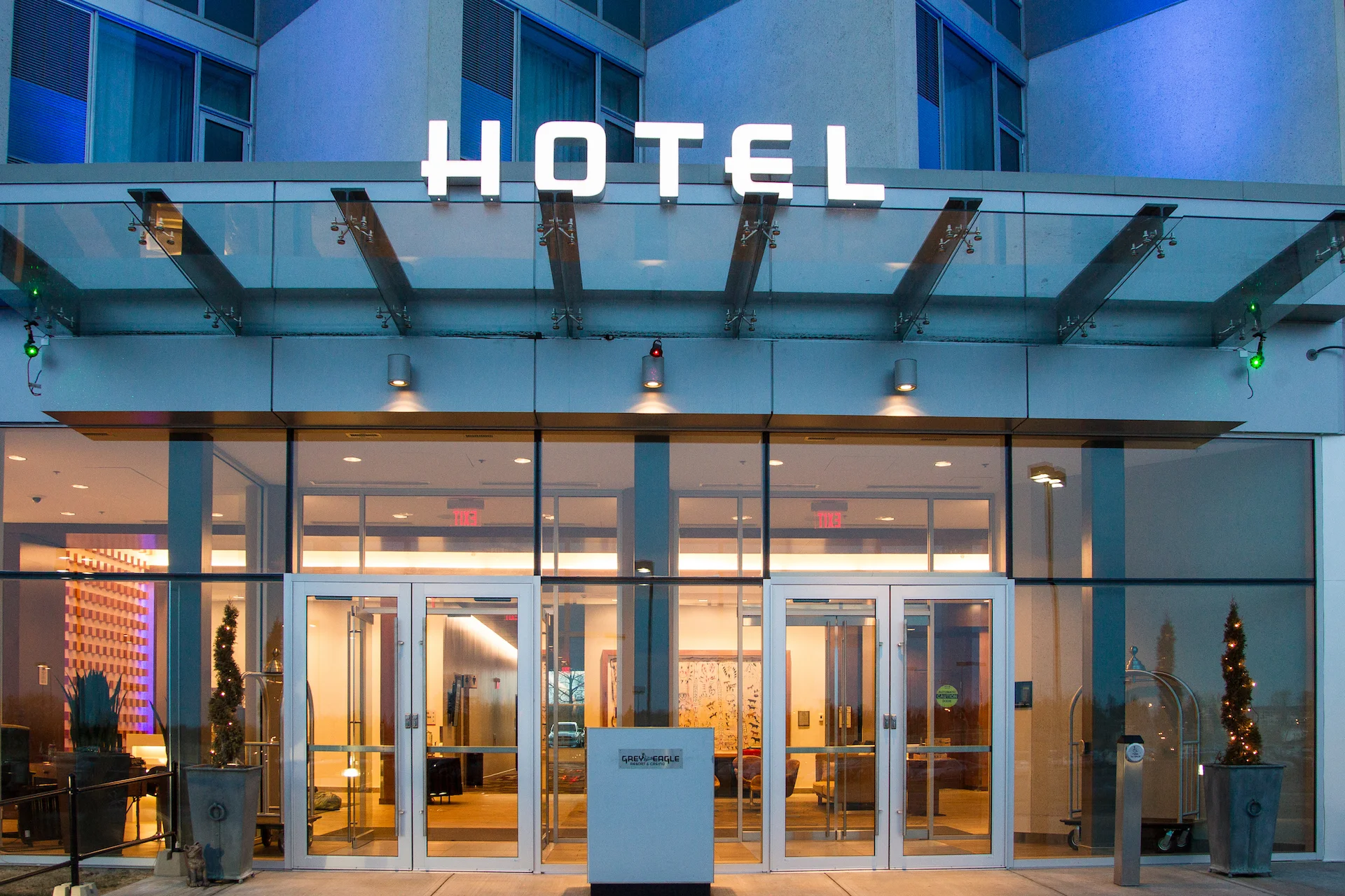 Alumicor 2500 series curtainwall with SSG, aluminum panels, Alumicor doors, glass canopy with spider fittings