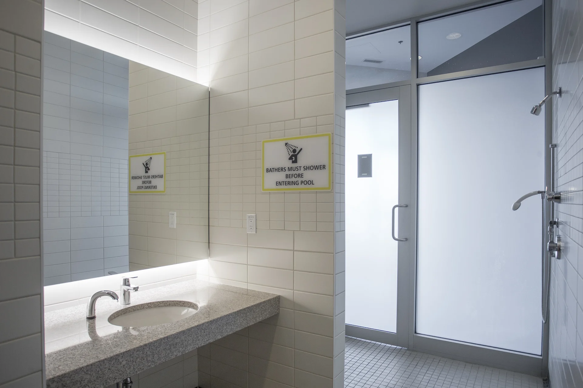 Common area washroom mirror, Alumicor 1800 series interior storefront, Alumicor door 