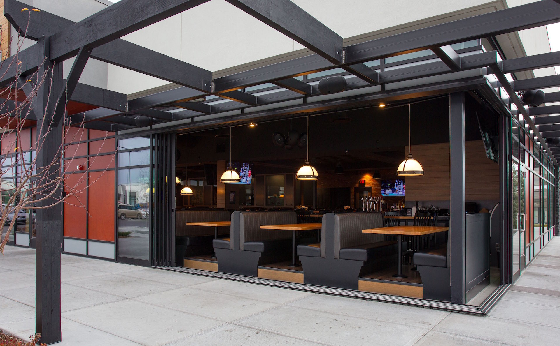 Fleetwood 3070CR custom multi-slide doors, Prodema spandrel panels, Alumicor 2500 series curtainwall and doors