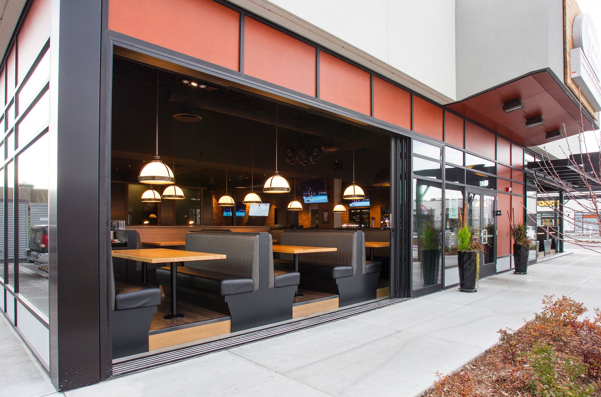 Fleetwood 3070CR custom multi-slide doors, Prodema spandrel panels, Alumicor 2500 series curtainwall and doors