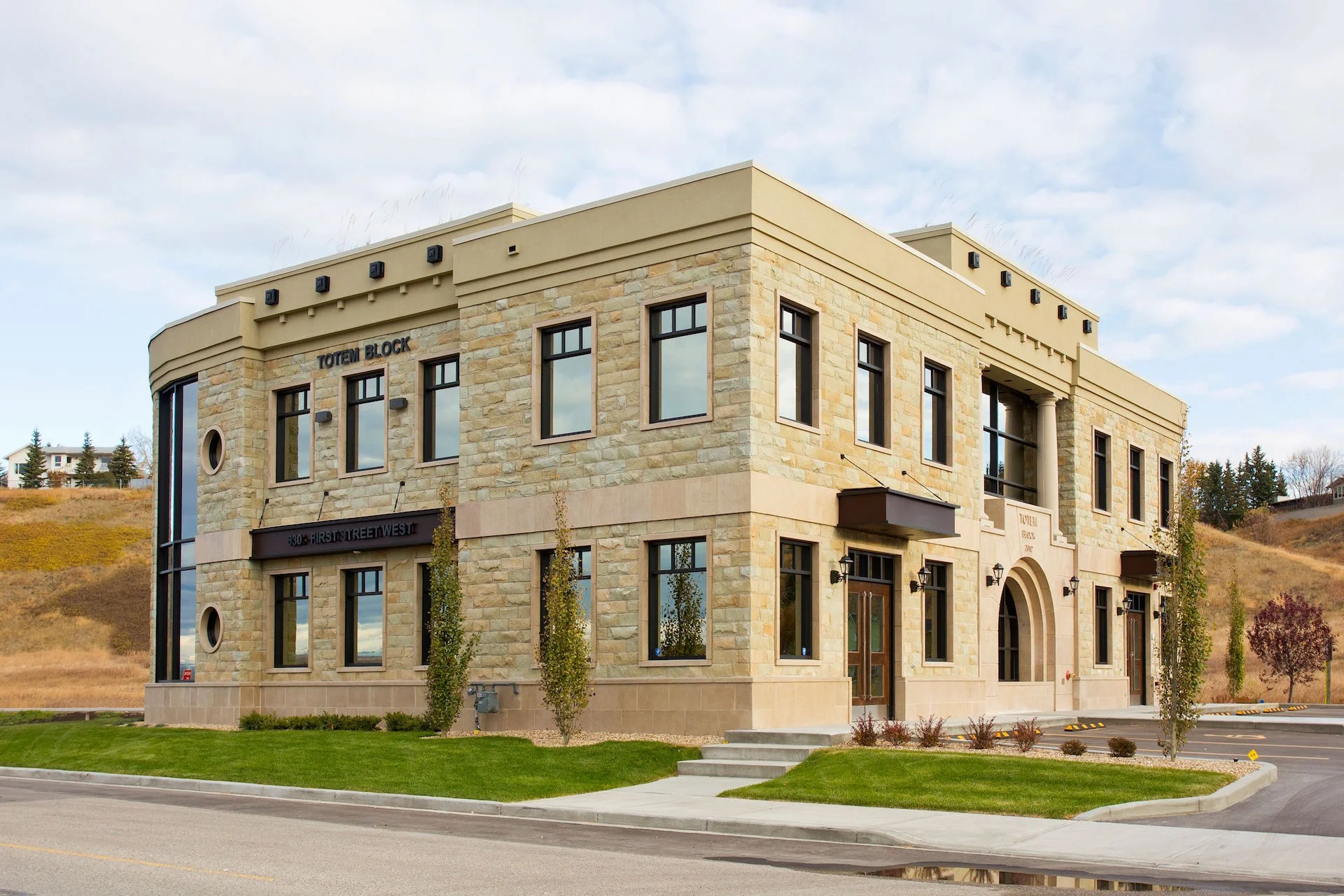 Alumicor 2200 series windows with 3-1/4" deep cap, custom wood doors, curved windows