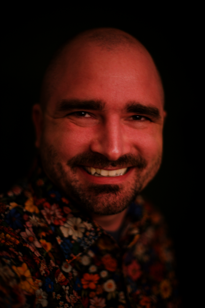 A picture of a middle aged bearded dude that is definitely bald