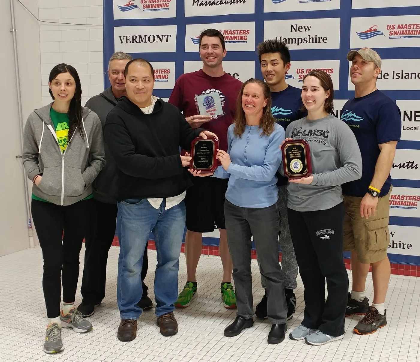 Members of CRM accept their team awards.