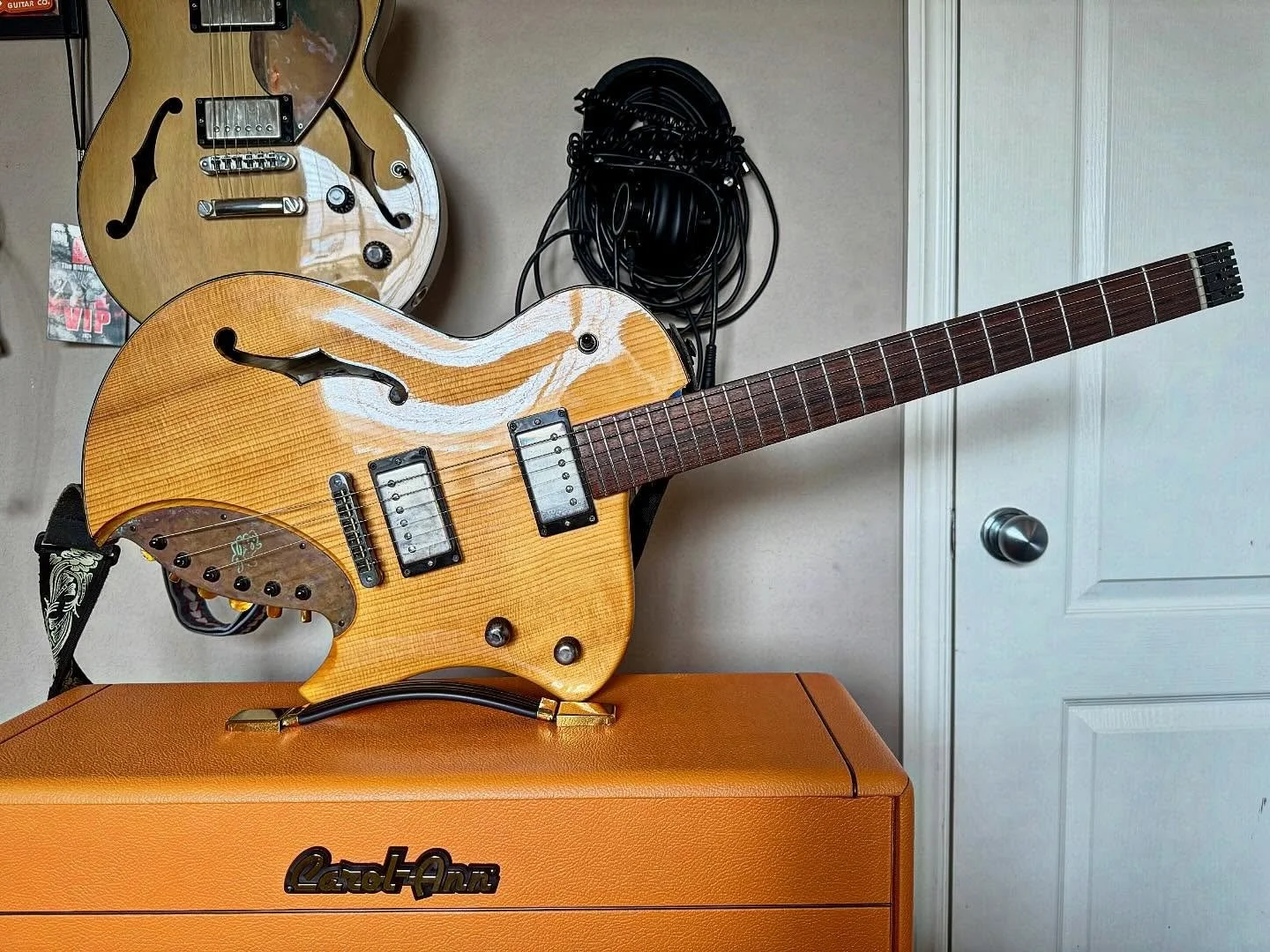 Aaron&rsquo;s guitars looking cool in the light. That&rsquo;s an RE model with spruce top in natural. Behind is a DL model in black limba.#spaghettialnerodesepia