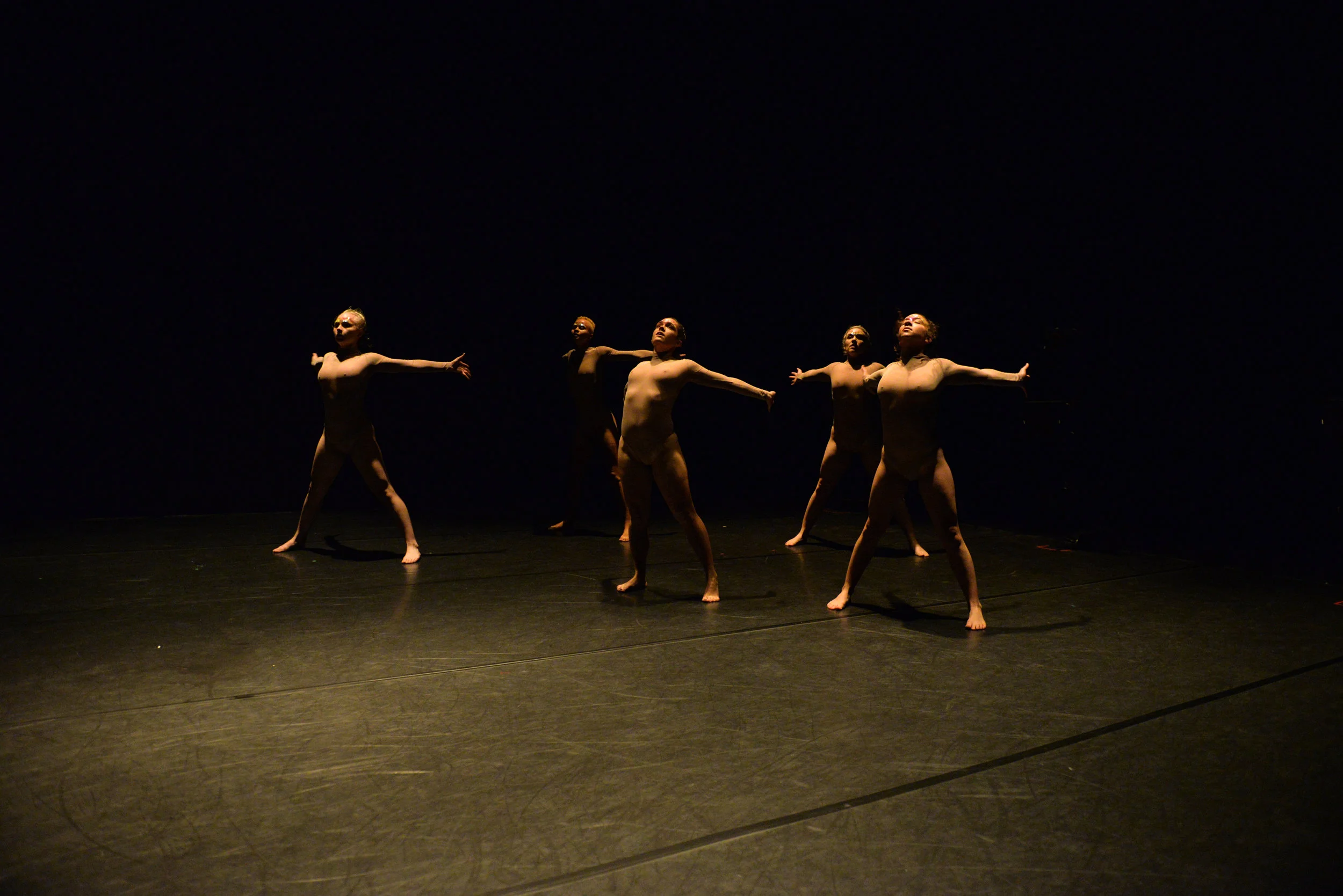 Photo of five dancers with arms wide, standing up. Photo by Jessica Schmitt from the 11th Annual REVERBDance Festival.
