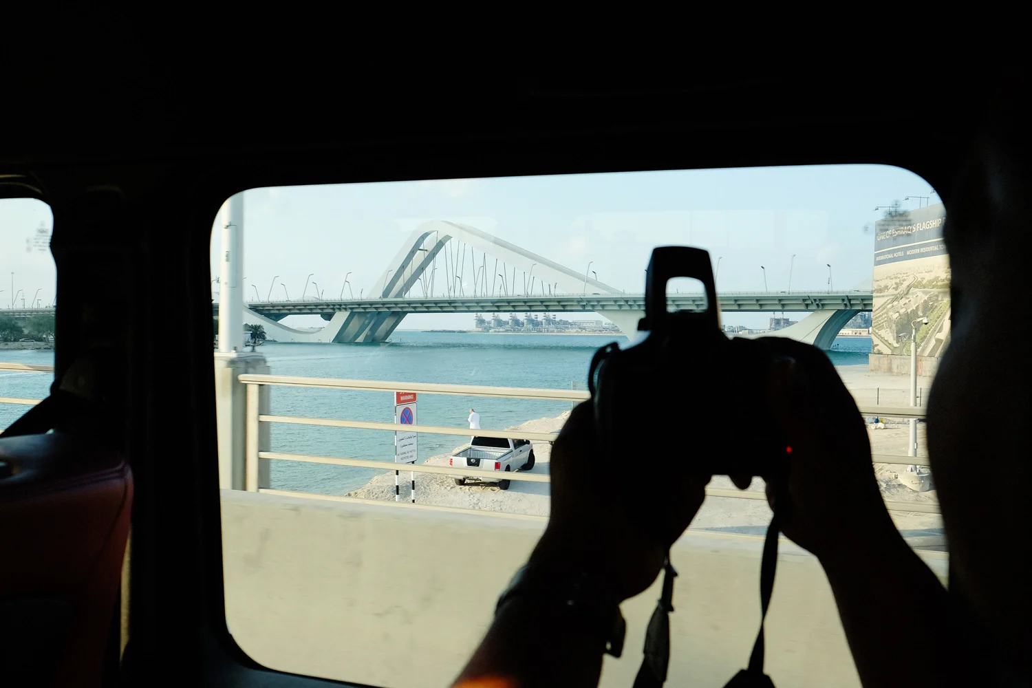 Albert snapping away as we are passing by the quirky Sheikh Zayed Bridge
