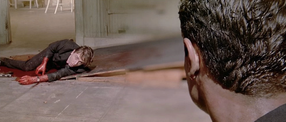 Film still from Reservoir Dogs (Quentin Tarantino, 1992). Source: http://film-grab.com/2013/11/18/reservoir-dogs/ An example of the variety of techniques used to shoot this film. This shot is achieved using a lens called a split focus diopter (like a magnifying glass cut in half) to create the illusion of deep focus.