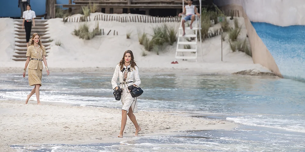 Kaia Gerber wears clothes from Chanel’s Spring/Summer 2019 collection on an artificial beach inside Paris’ Grand Palais.