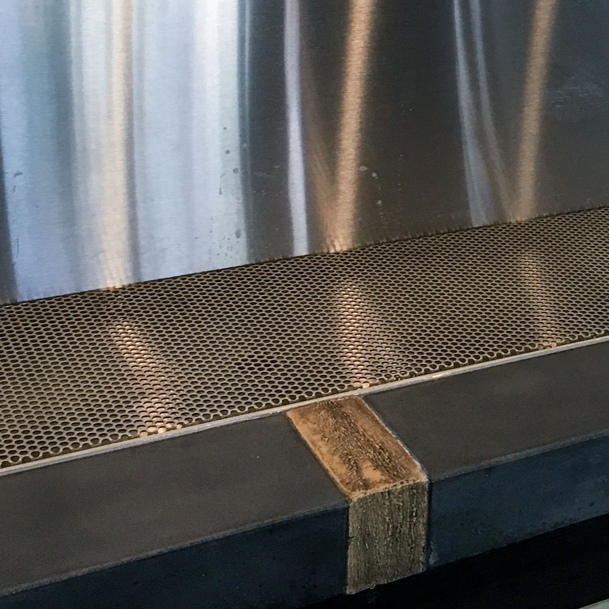  Wood tone concrete insets give the appearance of wood while offering the durability of concrete in the wet taproom environment 