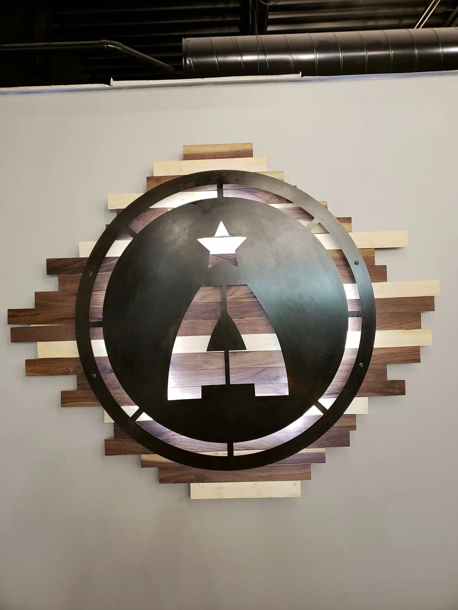 Custom designed wood and steel backlit sign