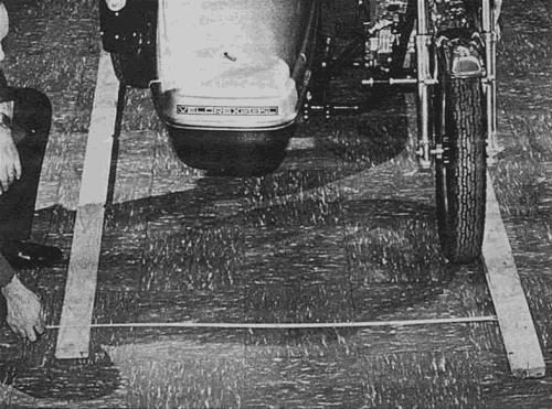 Take Toe-in measurement about one foot ahead of the front tire. Distance must be between 1/2 inch to 3/4 inches less than at rear.