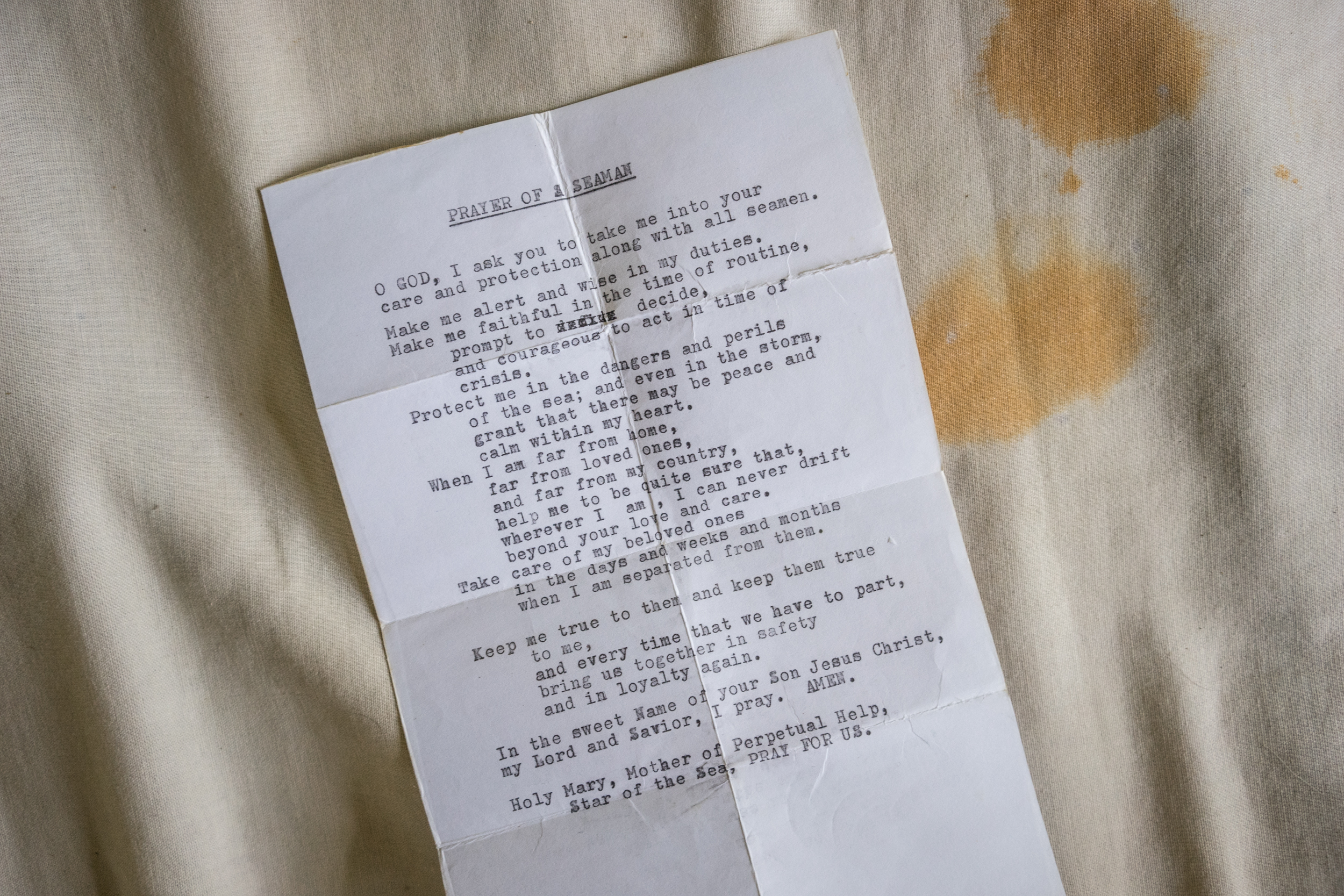  Kalibo, Philippines - September 20, 2015: A slip of paper with a typewritten prayer for seafarers is seen in the home of Reden Remorate. Remorate is one of the victims of a Singapore based  maritime manning agency whose recruits are vulnerable to ab