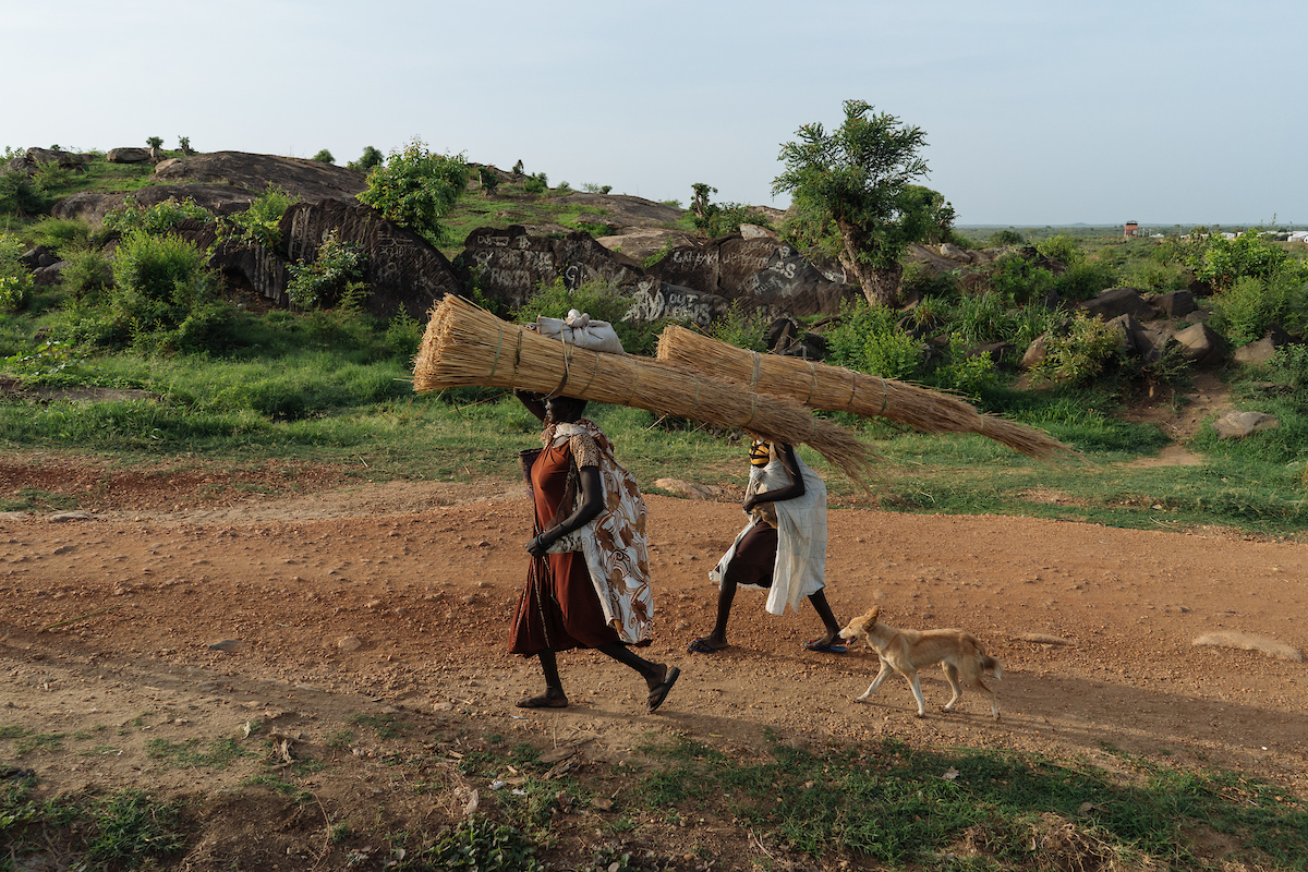 Women return home after collecting firewood for their homes. In South Sudan, women and girls displaced from war must leave protection of civilians sites to collect firewood - a task traditionally done by women, who make up majority of the population in these camps. The journey is perilous and puts these women at continued risk of sexual violence, which rights groups have called an 'epidemic' in the country.