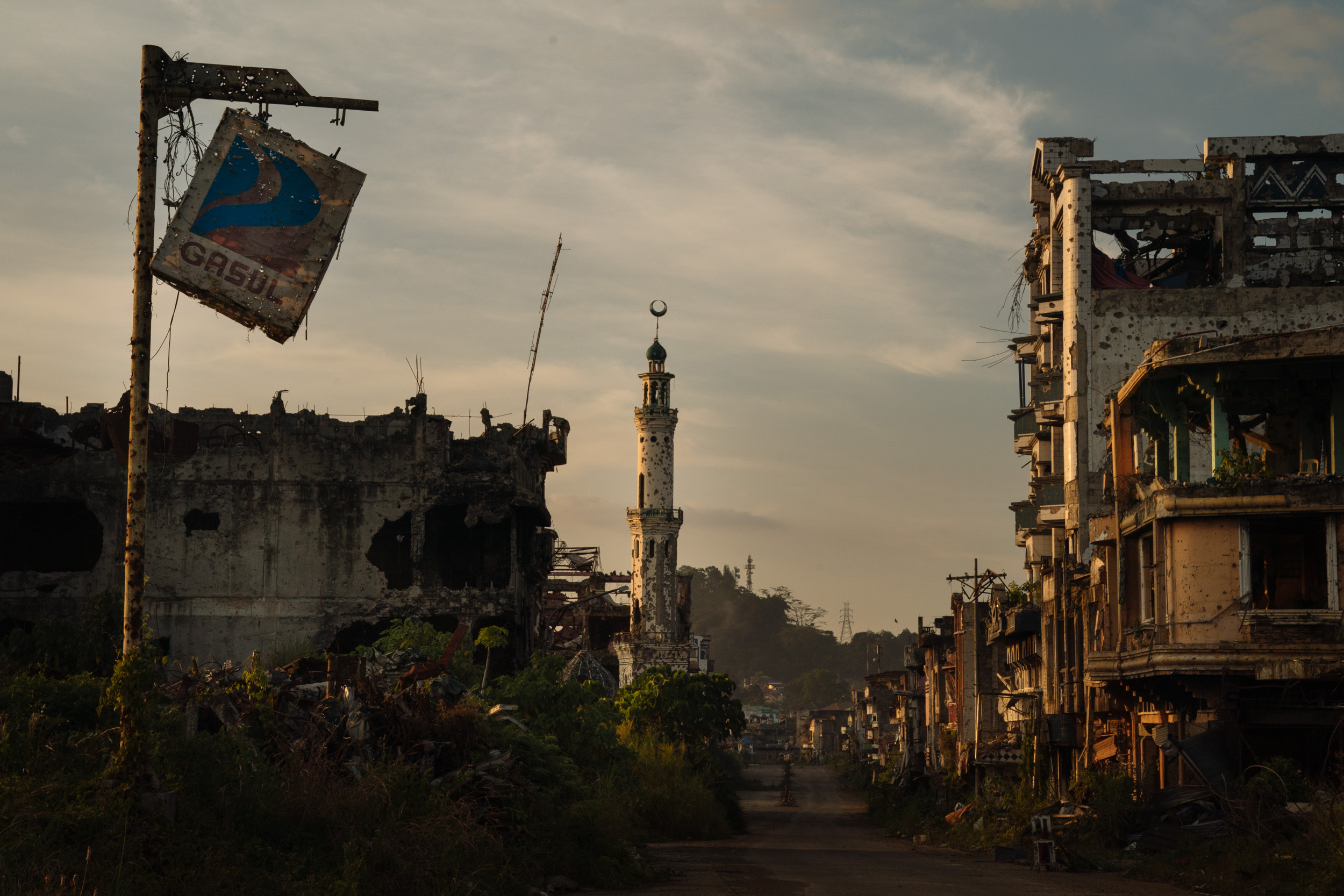  The ruins of Marawi City are seen at sunset. It has been more than a year since the Philippine military declared the Muslim-majority city of Marawi “liberated” from ISIS-linked militants, but the city remains a ghost town, and locals are becoming mo
