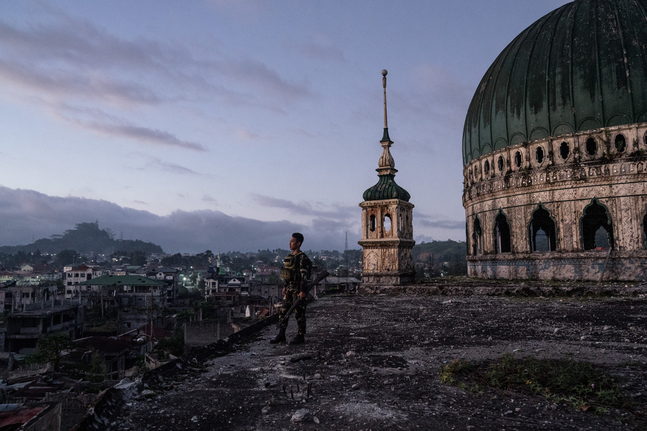  A soldier is seen in the Grand Mosque, which was destroyed during the Marawi siege. The masjid is still damaged more than a year since the Philippine military declared the Muslim-majority city of Marawi “liberated” from ISIS-linked militants. But th
