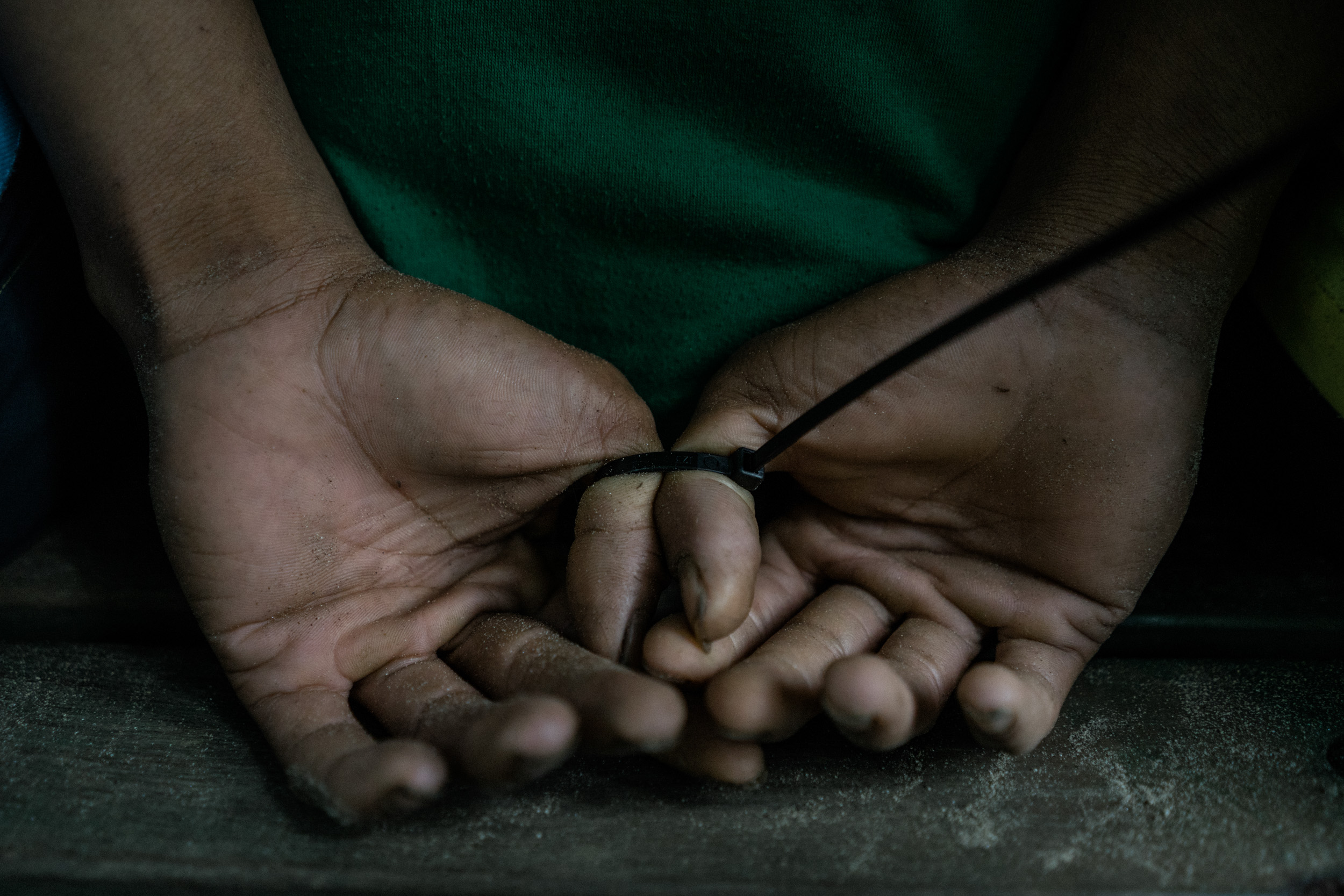  Hands of a man are seen tied up after his arrest. The man is part of a group suspected of dealing drugs and supplying the ISIS inspired Bangsamoro Islamic Freedom Fighters with weaponry. He was arrested in an operation by a Philippine Army battalion