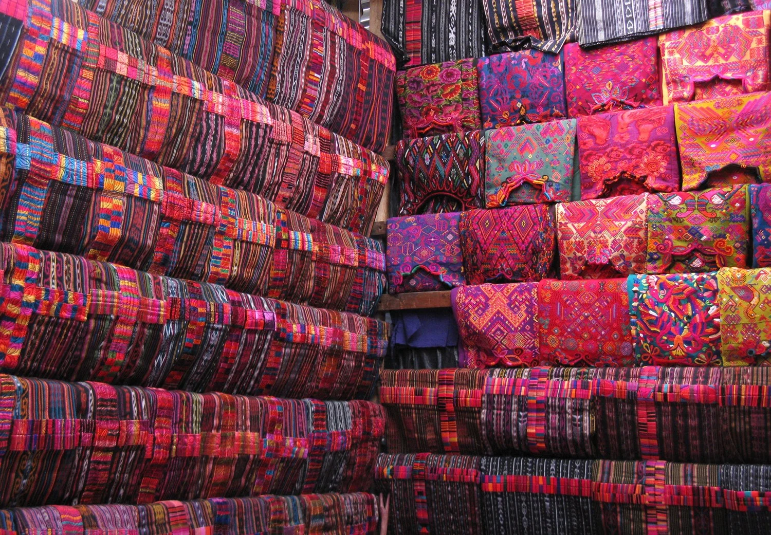  Tienda de huipiles y cortes (shop with Mayan blouses and skirts), Chichicastenango Market, Guatemala.&nbsp; 2014  Love those colours! Mayan traditional dress is so beautiful, colourful. The markets where textiles are sold are an incredible visual tr