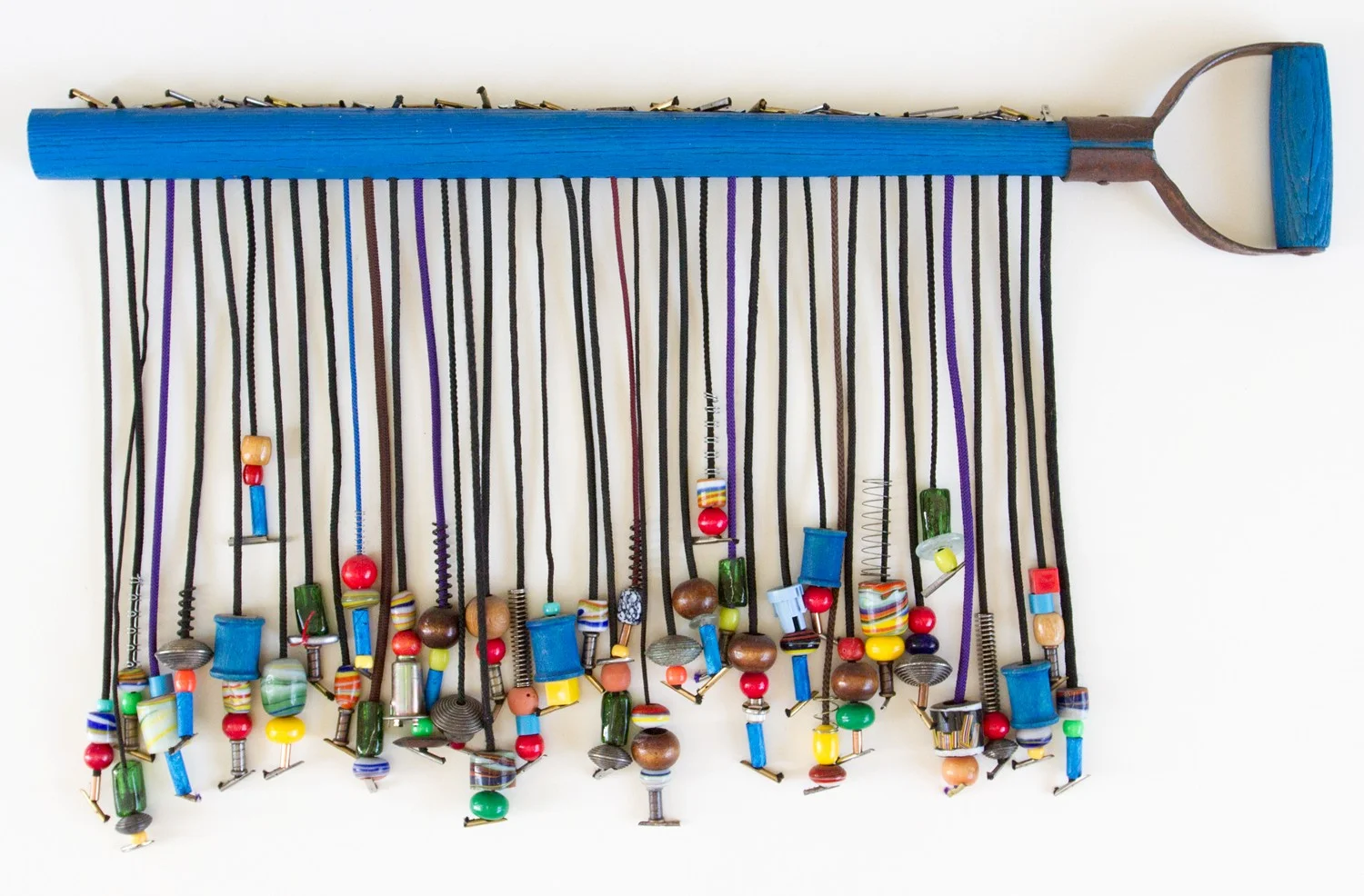 DIG 2012 ~ 26.5x16x1.5 inches ~ Available Shovel handle, beads, found objects of wood, metal, plastic, glass, cotton, polyester