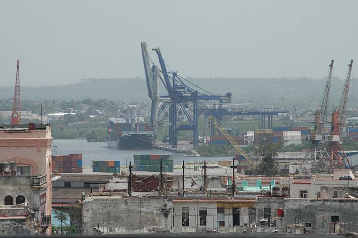 It could be some time before Cuban container cranes, such as these pictured in Havana, start lifting more volumes bound for international markets.