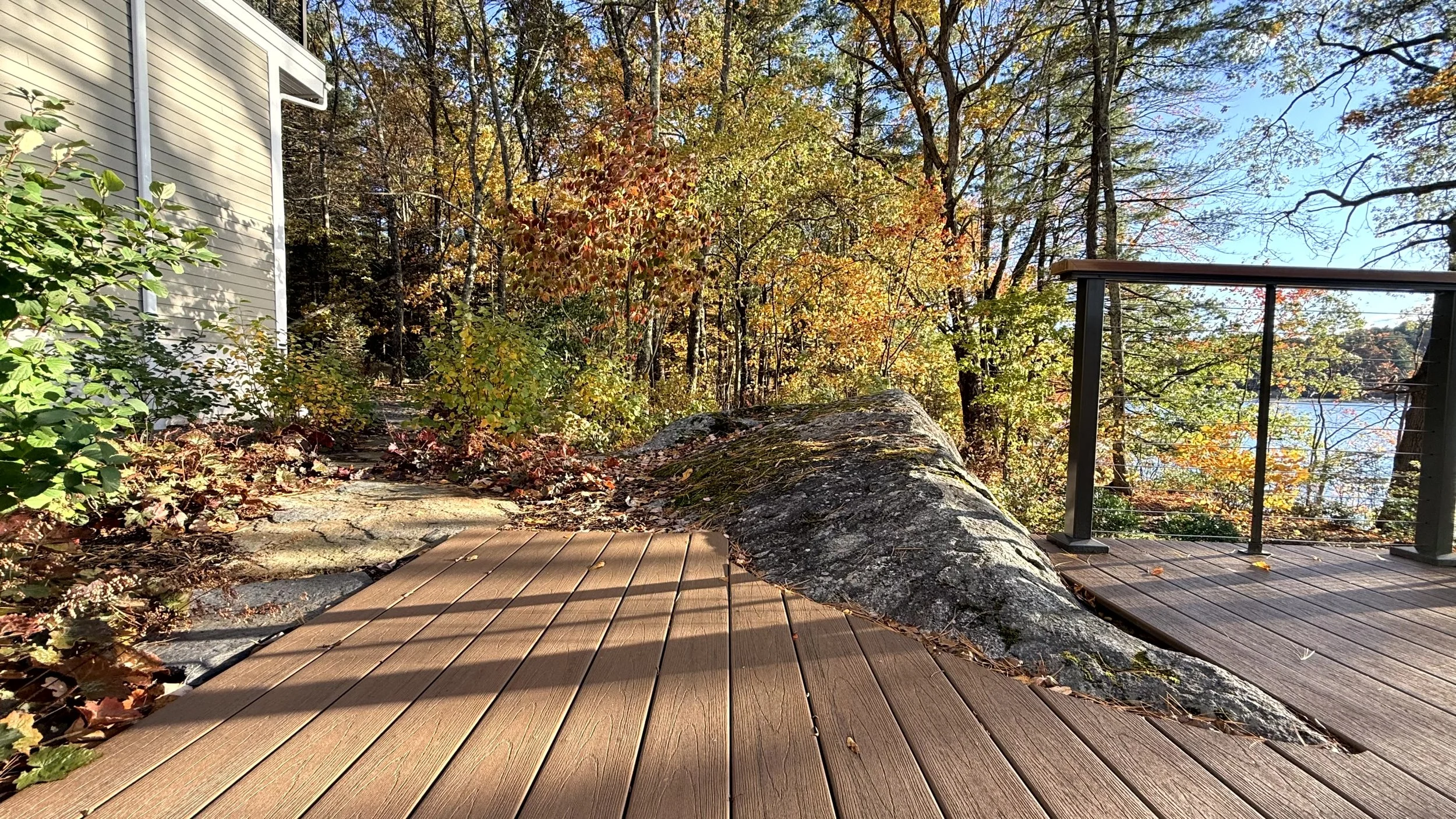 Deck surrounds boulder outcrop