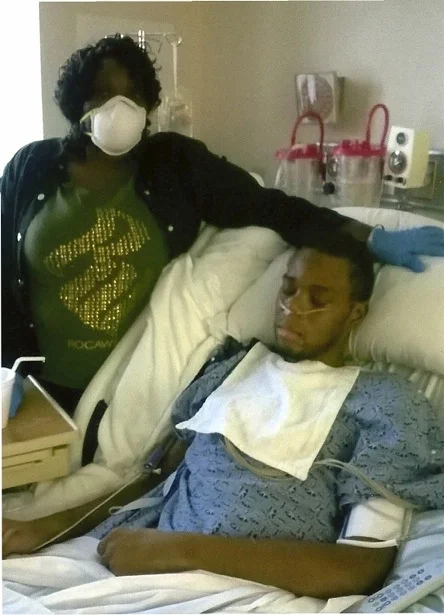 Nathan King on his deathbed, with his mother. Photo provided by his family.