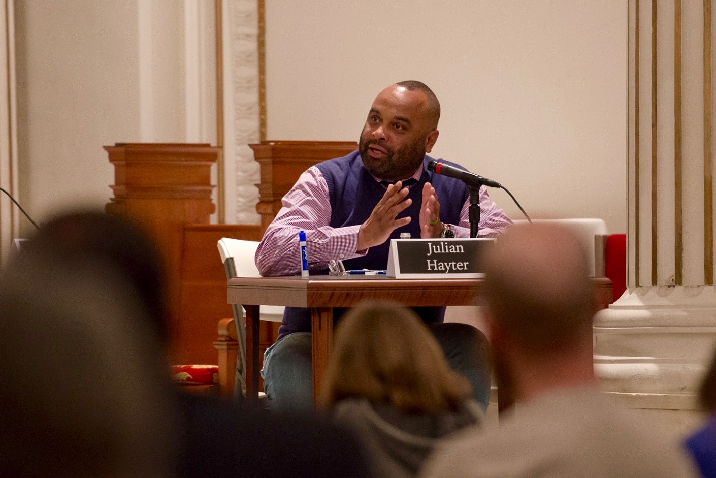  Dr. Julian Hayter, Assistant Professor of Leadership Studies at the University of Richmond's Jepson School, moderated the debate. (Photo by Matt Cowan for Richmond Justice) 