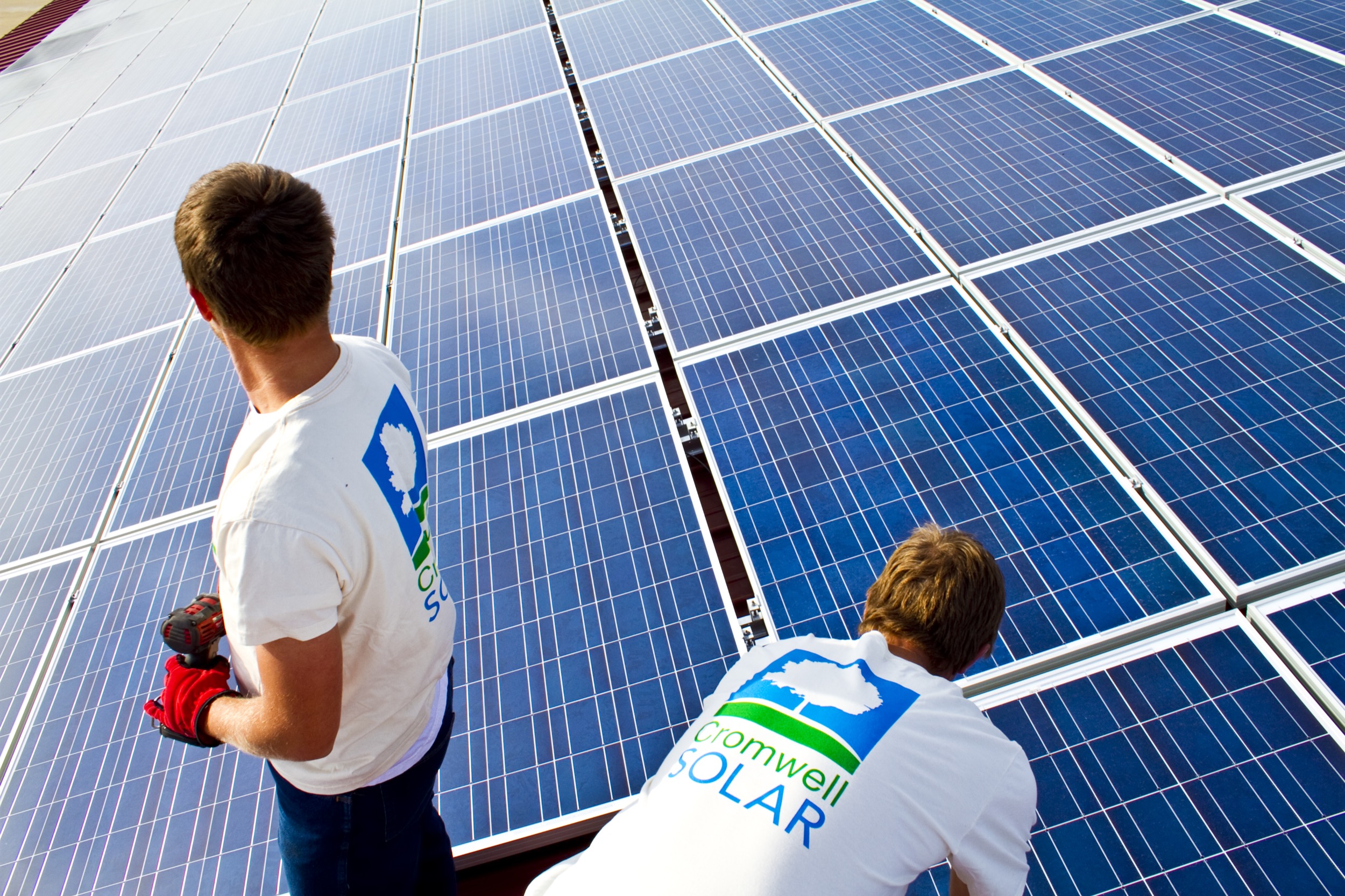 Cromwell Solar crew installing a panel © 2015 Cromwell Environmental