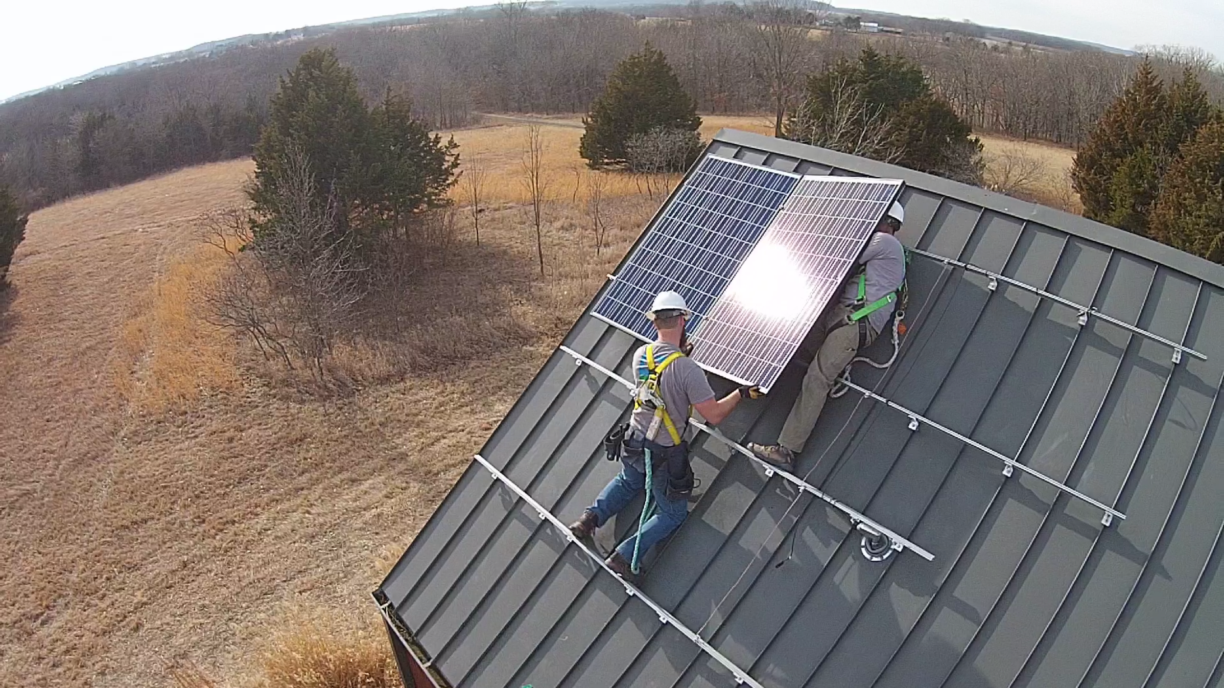 Cromwell Solar crew installing a panel © 2015 Cromwell Environmental