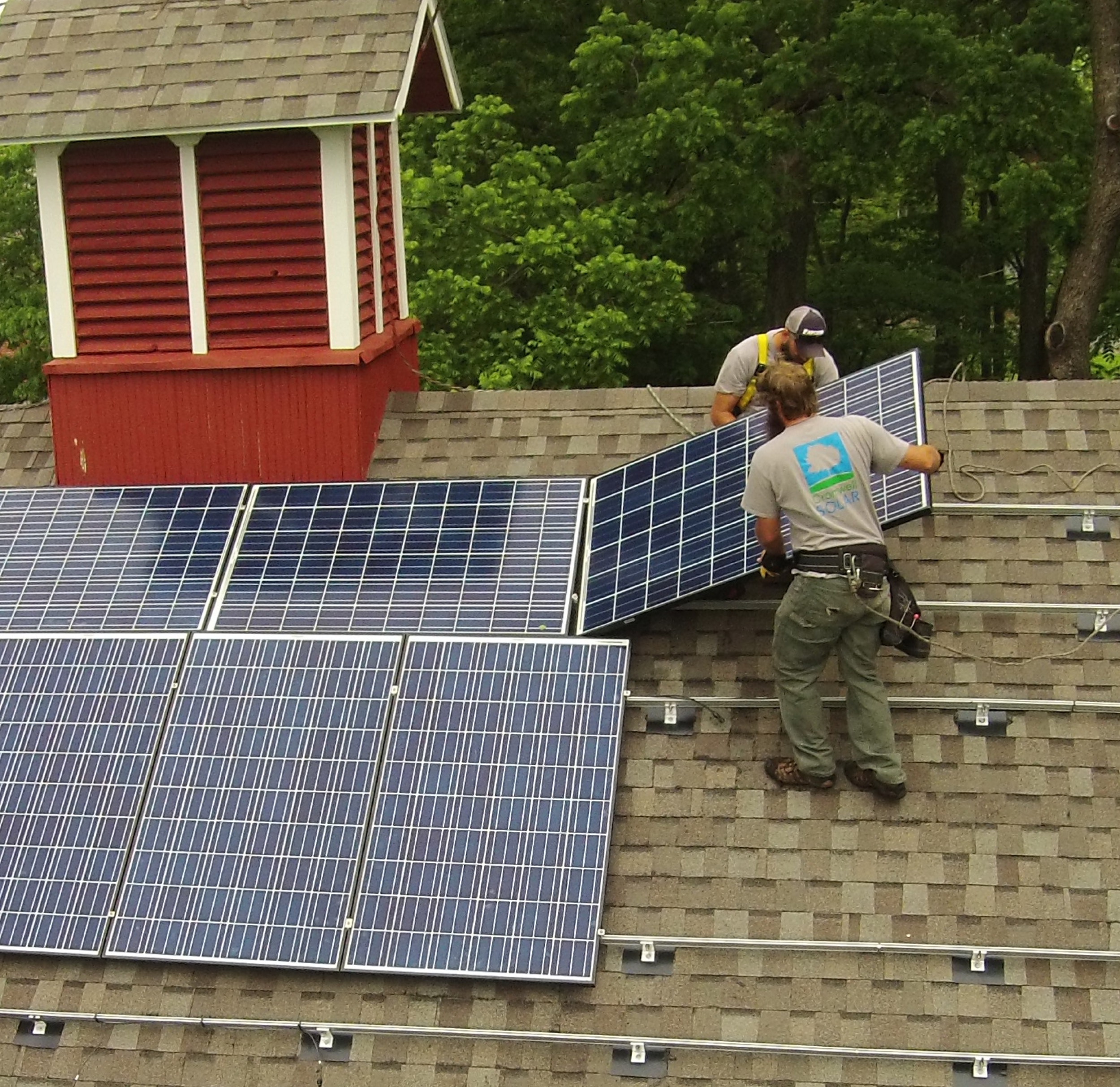 Cromwell Solar crew installing a panel © 2015 Cromwell Environmental