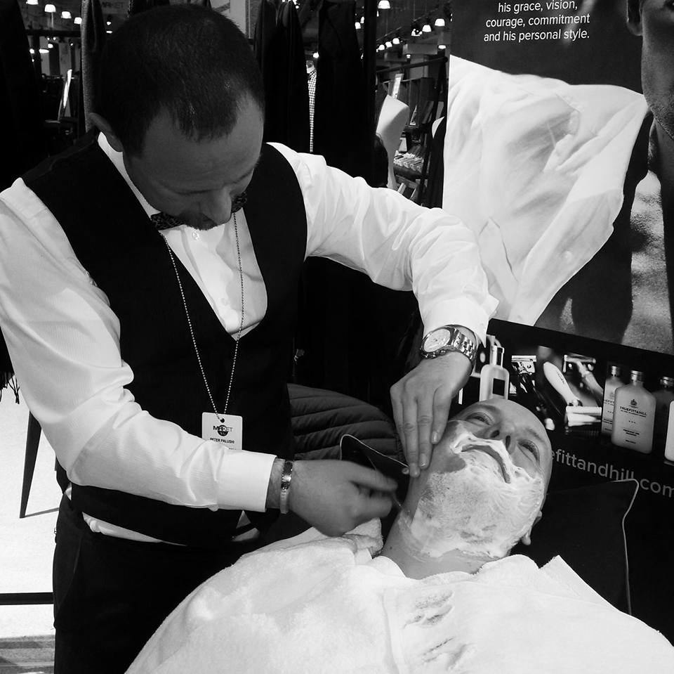 Peter Palushi, owner of Gentleman's Barber Spa in White Plains, performs the Royal Shave for Truefitt & Hill