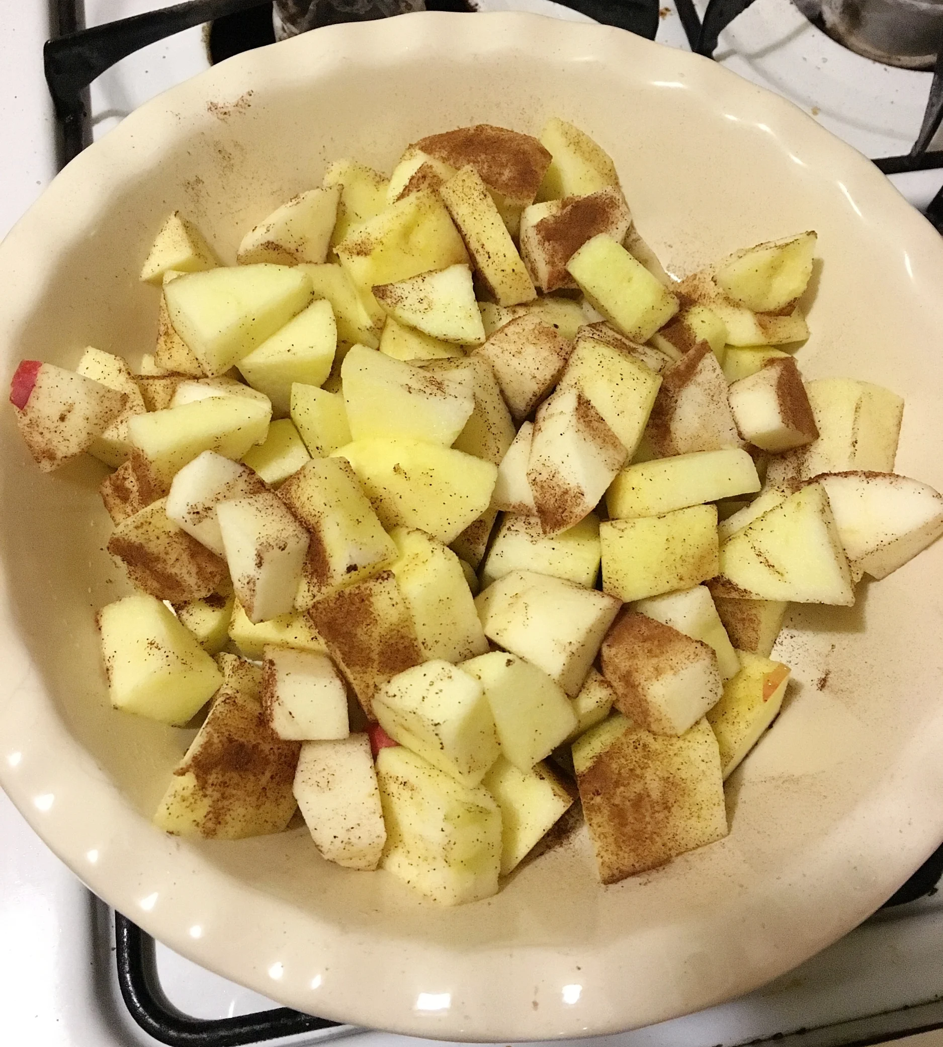 Cube up your apples in about 1 inch pieces. Sprinkle them with a tiny bit of cinnamon, not from the 1 tsp in the recipe, and a little bit of sugar or honey if your apples are very tart. These apples were particularly sweet so I didn't add anything but cinnamon. If you are going to use different fruit in this recipe like blueberries or something that has more liquid in it, sprinkle the fruit with a bit of corn starch so as they cook it will create a sauce rather than a liquidy mess!!