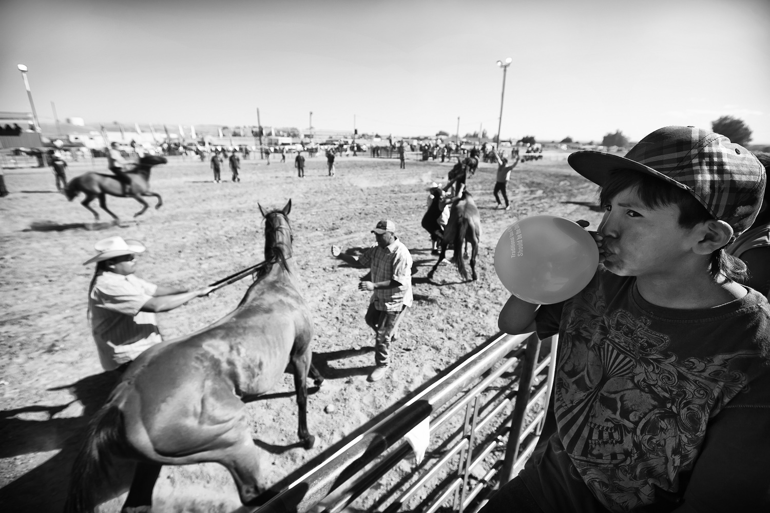  Indian Relay Races are staples at tribal rodeos and allow participants to acknowledge and revere their cultural history of horsemanship and bravery. A young Native American boy concentrates on his balloon as others participate in the Relay Races at 