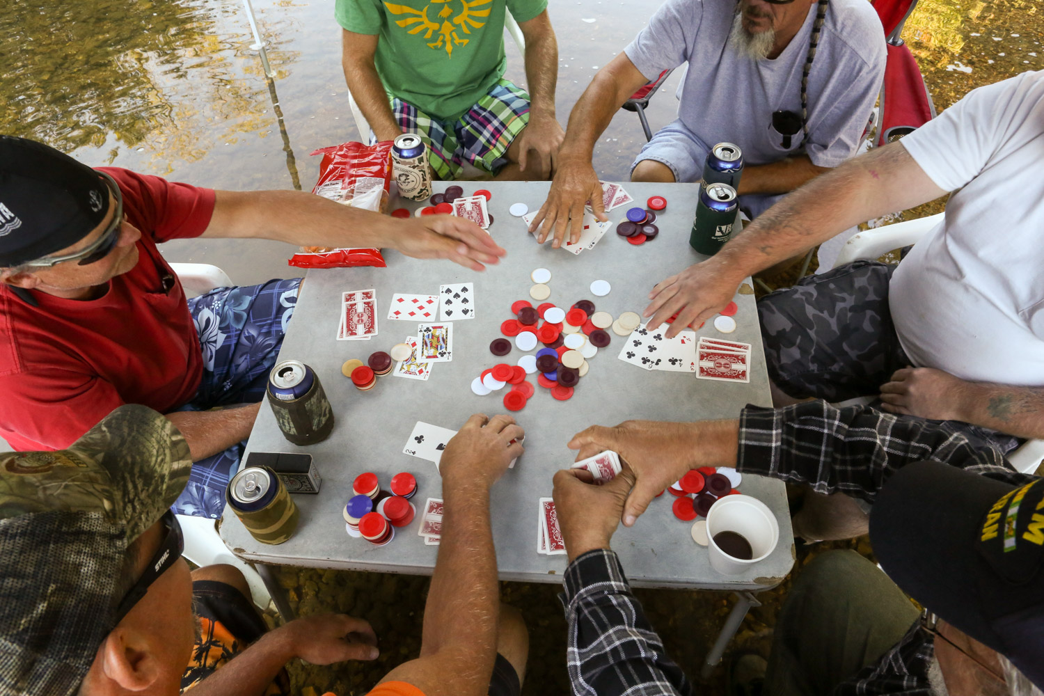  Paul and Joe play poker and drink beer with friends and coworkers. Their unique tradition started several years ago while camping during summer heat. 