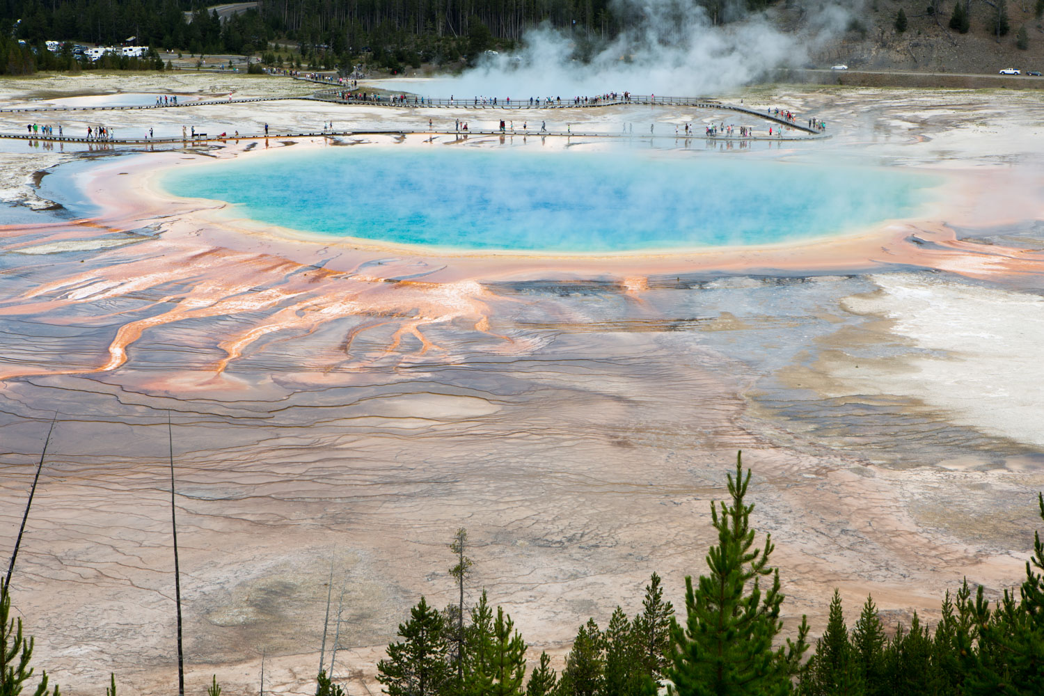 Eric Kruszewski photographs a Yellowstone hot spring for National Geographic Expeditions.