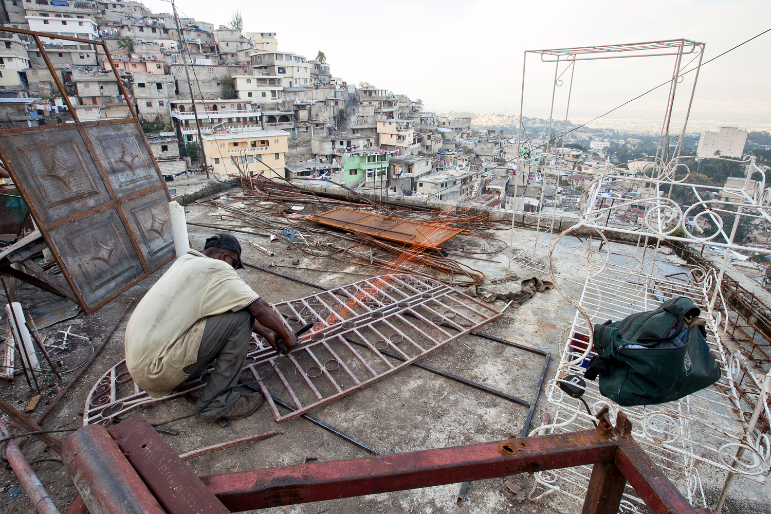  Views into overbuilt and crowded cities outside of the village act as a vivid reminder that progress remains thwarted and choked as few people attempt to rebuild and develop. 