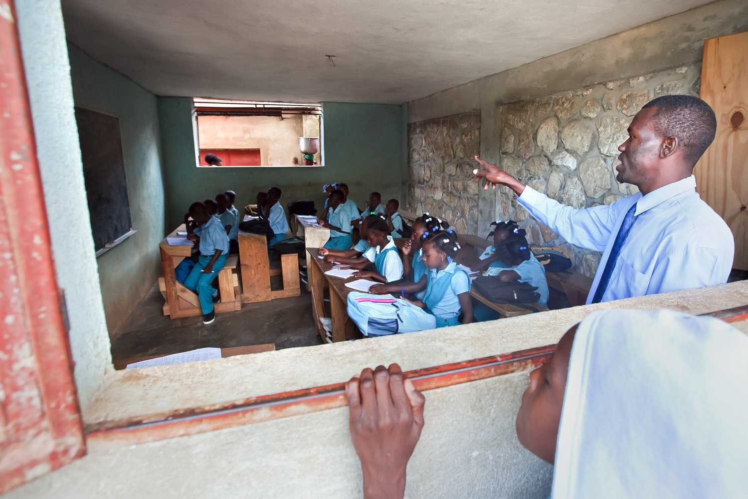  The opportunity for free education at Gramothe's school draws children from miles away. Some walk four hours a day to attend in return for the prospect of a brighter future. 
