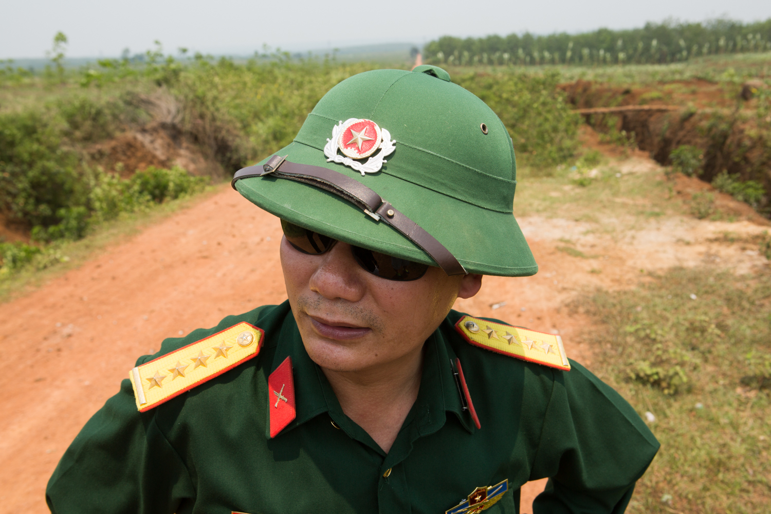 Eric Kruszewski photographs a portrait of an officer in Vietnam.