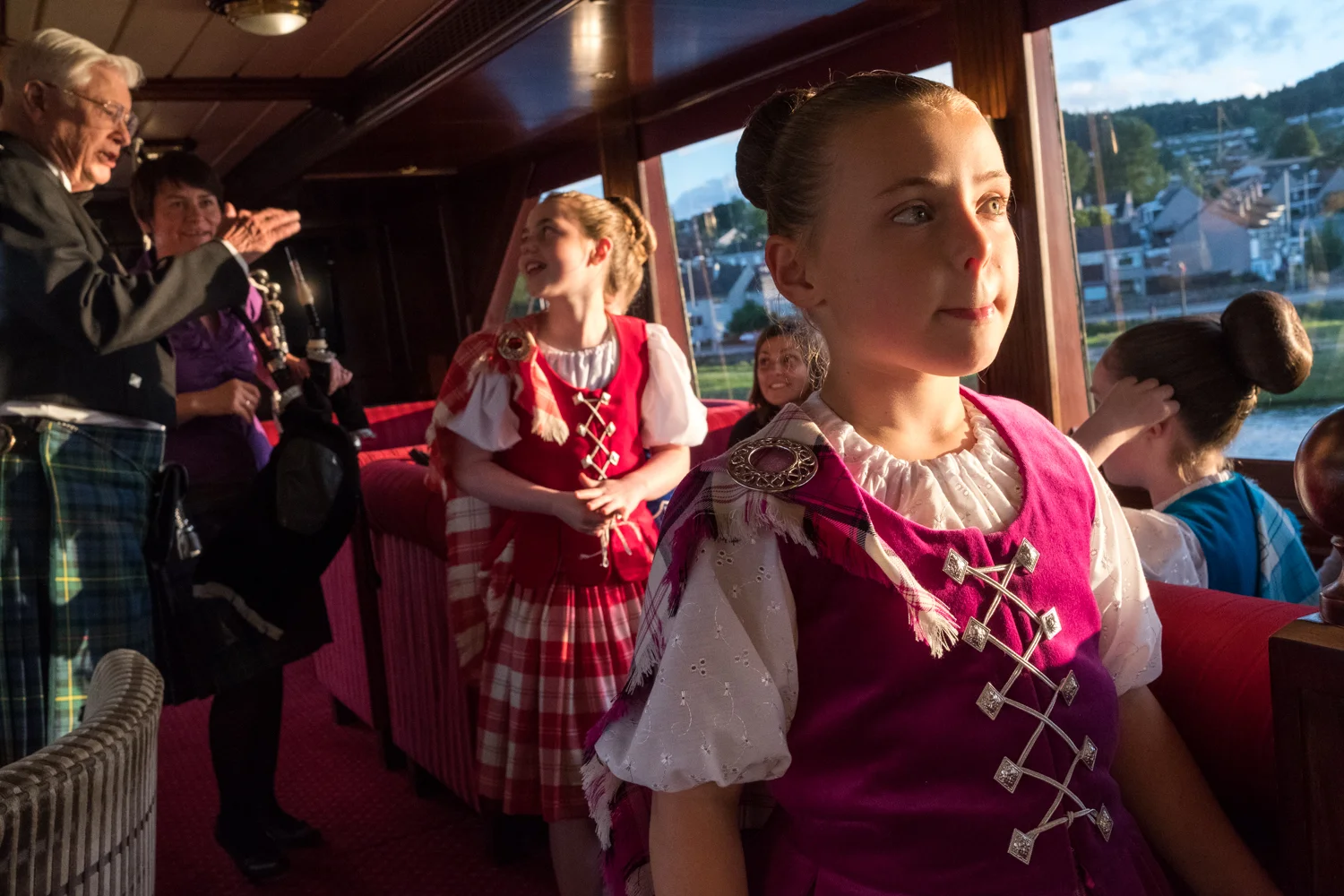 A young Highland dancer waits for her chance to perform for guests aboard Lord of the Glens.