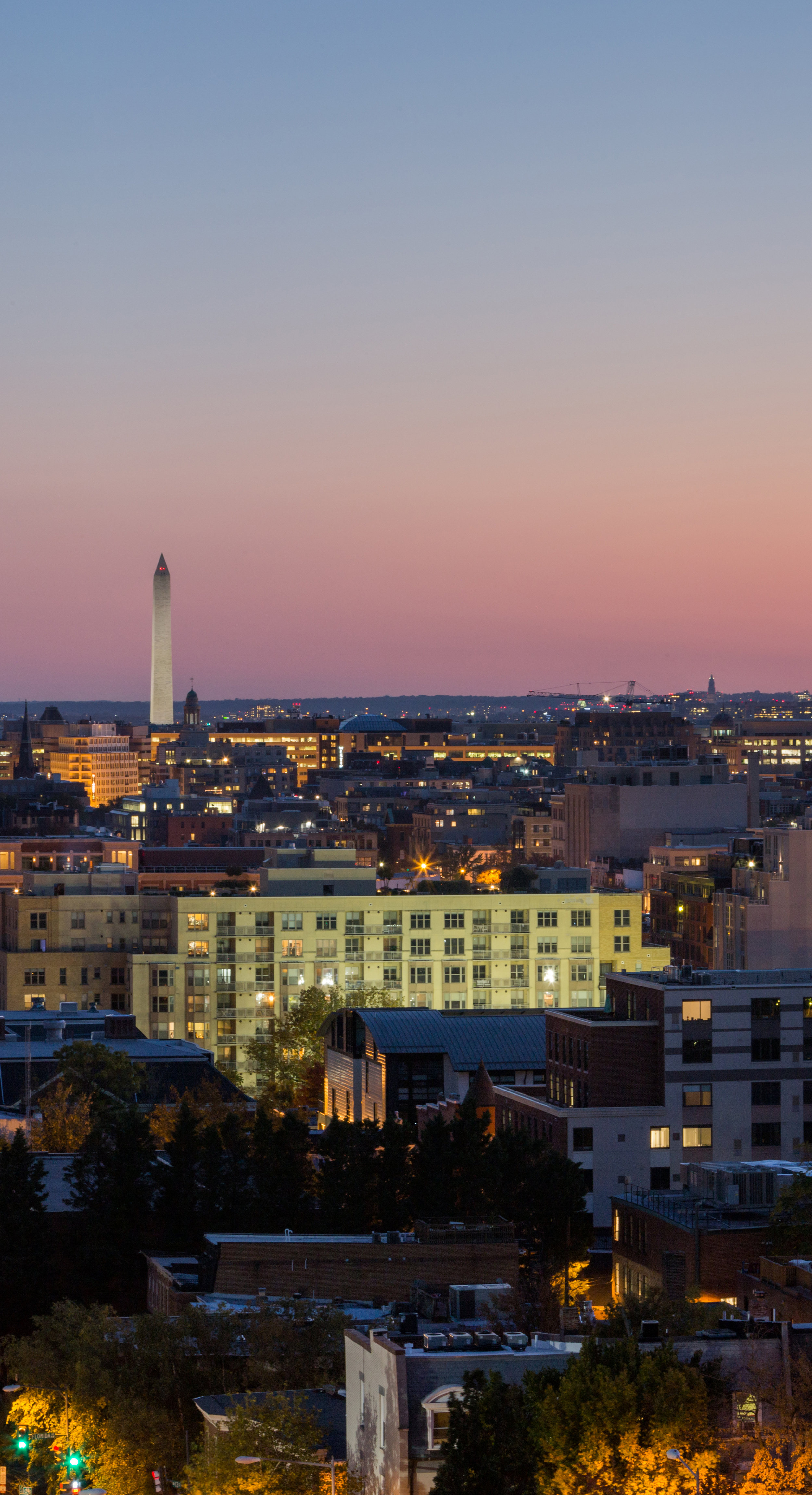 Eric Kruszewski photographs a panorama landscape of the Washington, D.C. skyline at sunset.