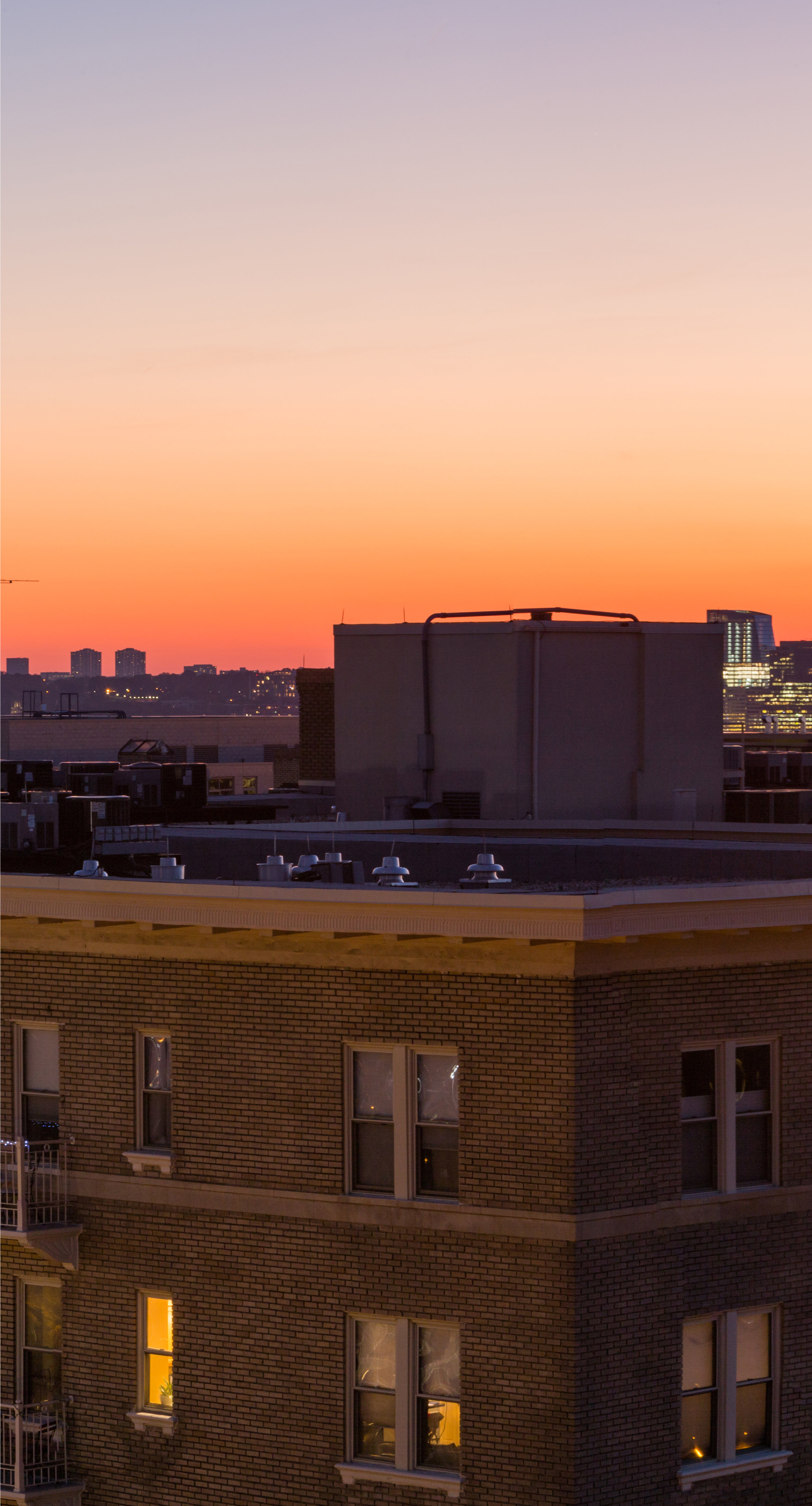 Eric Kruszewski photographs a panorama landscape of the Washington, D.C. skyline at sunset.