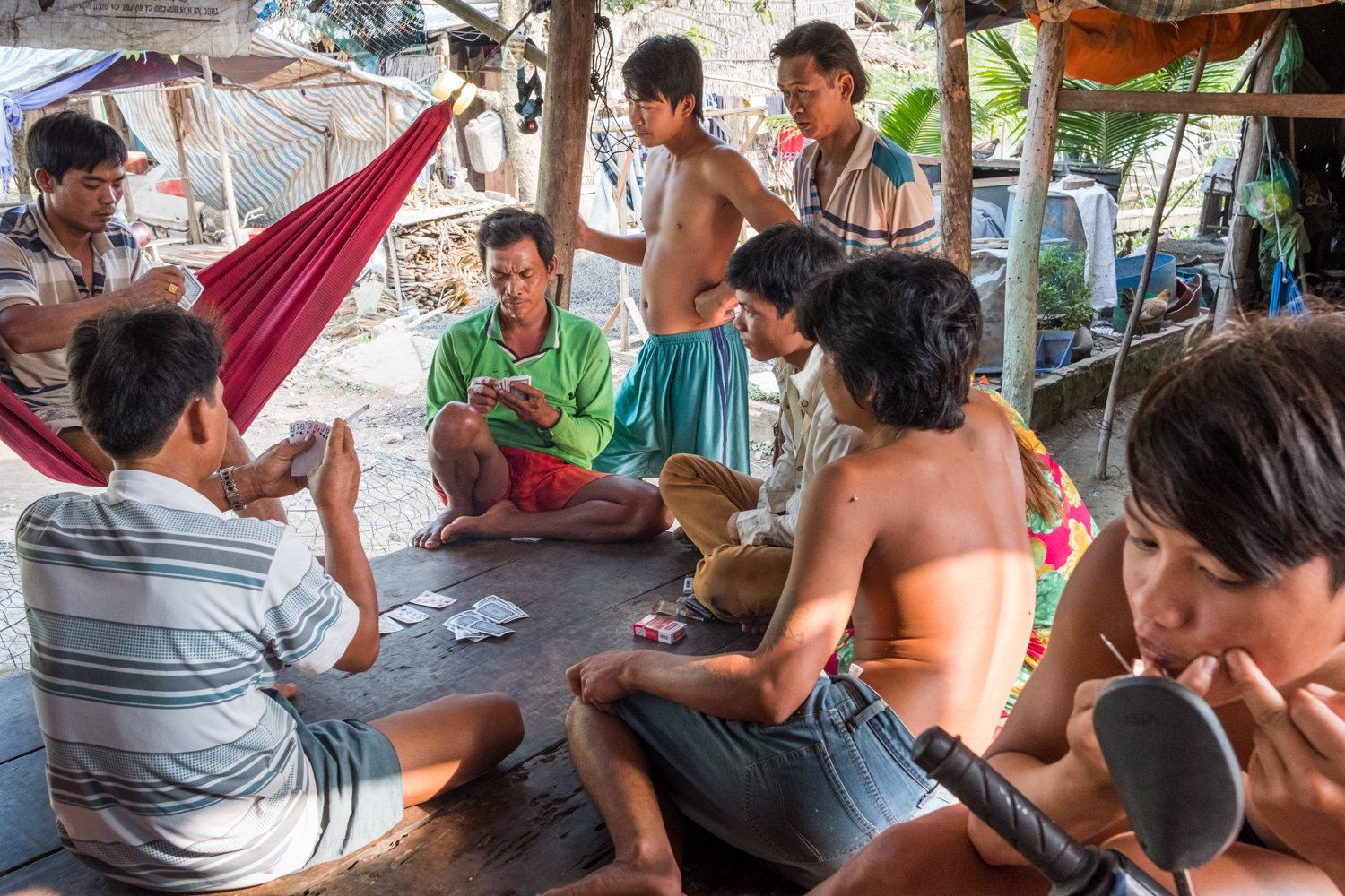  The peaceful Binh Thanh Island is a wonderful locale within the Mekong Delta to see how Vietnamese villagers live, including the everyday simple activities like playing cards and popping pimples. 