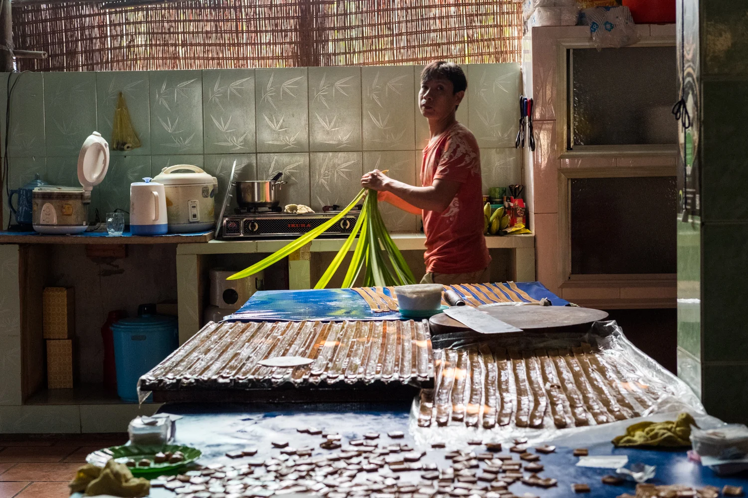 In Cai Be, a man prepare ingredients to make candies from palm sugar.
